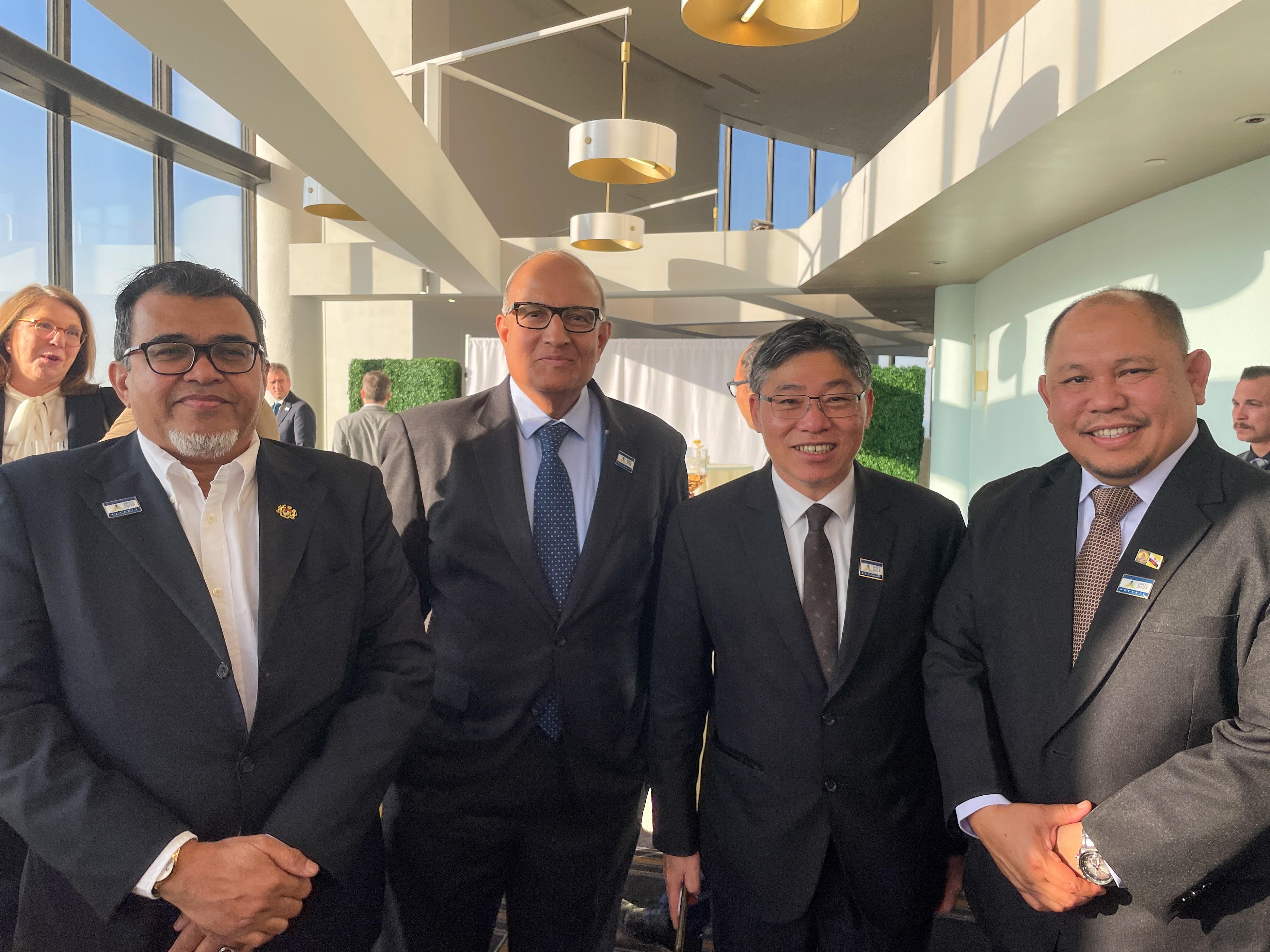 The Secretary for Transport and Logistics, Mr Lam Sai-hung (second right), is pictured with the representatives of Malaysia, Singapore and Brunei Darussalam (from left) during the 11th Asia-Pacific Economic Cooperation Transportation Ministerial Meeting in Detroit, the United States (US), yesterday (May 15, US time).