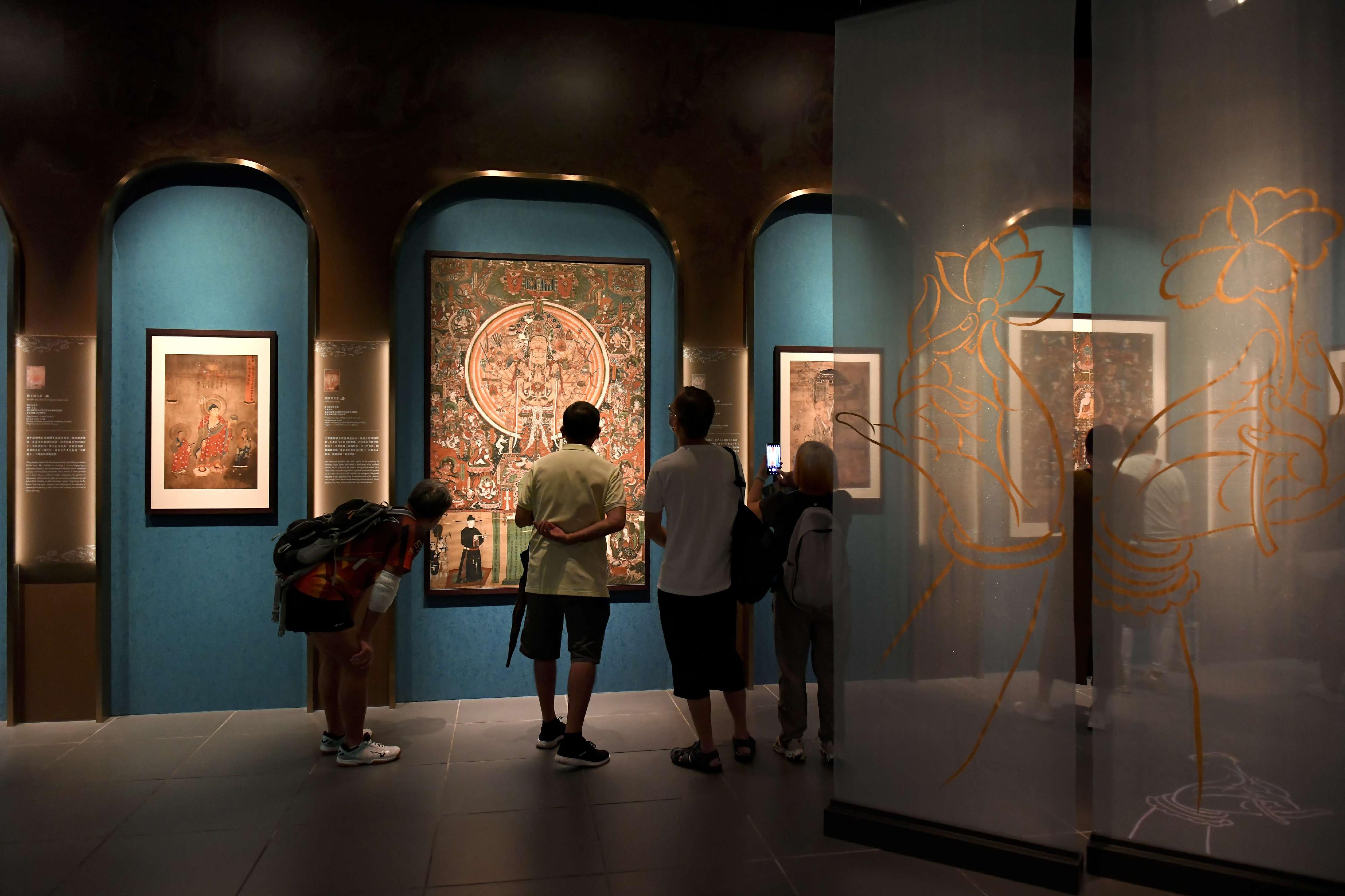 The exhibition "Dunhuang: Enchanting Tales for Millennium", held earlier in the Hong Kong Heritage Museum, has been awarded an International and Hong Kong-Macao-Taiwan Cooperation Nomination Award from the 20th National Top Ten Museum Exhibitions (2022). Photo shows visitors inside the exhibition.