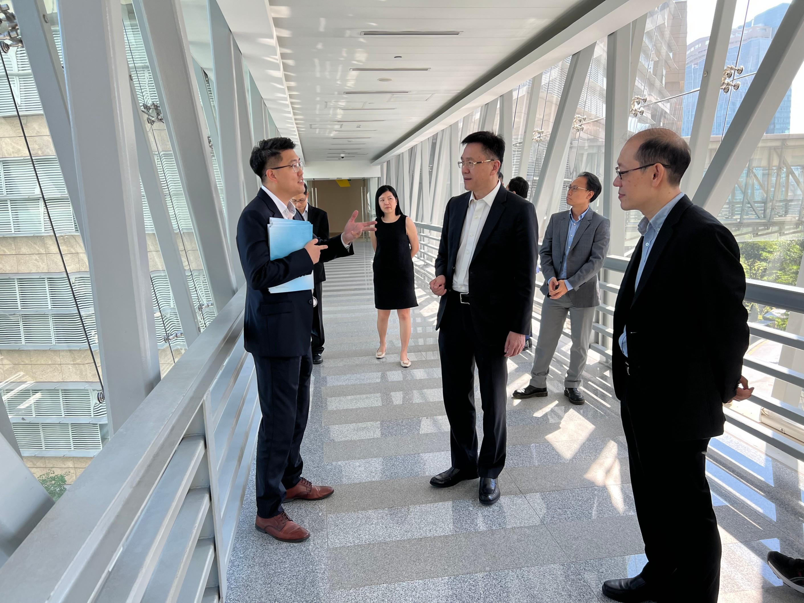 The Secretary for Innovation, Technology and Industry, Professor Sun Dong (third right), tours Biopolis, one of the precincts of One-north, in Singapore today (May 24).