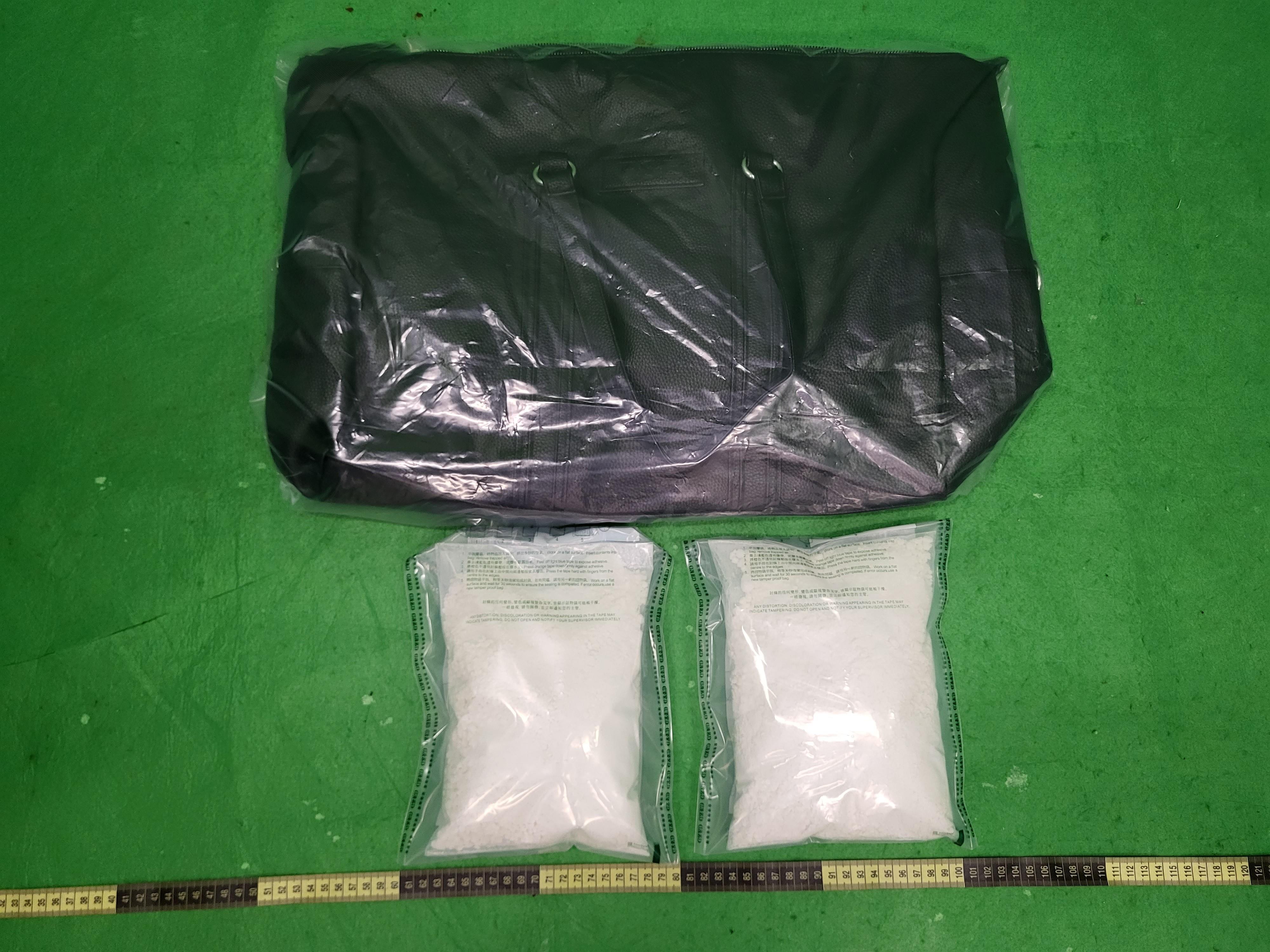 Hong Kong Customs detected two incoming passenger drug trafficking cases at Hong Kong International Airport and seized a total of about 2.5 kilograms of suspected cocaine with an estimated market value of about $2.7 million over the past two days (May 22 and 23). Photo shows the suspected cocaine seized by Customs officers in the second case and the hand-carry baggage used to conceal the drug.