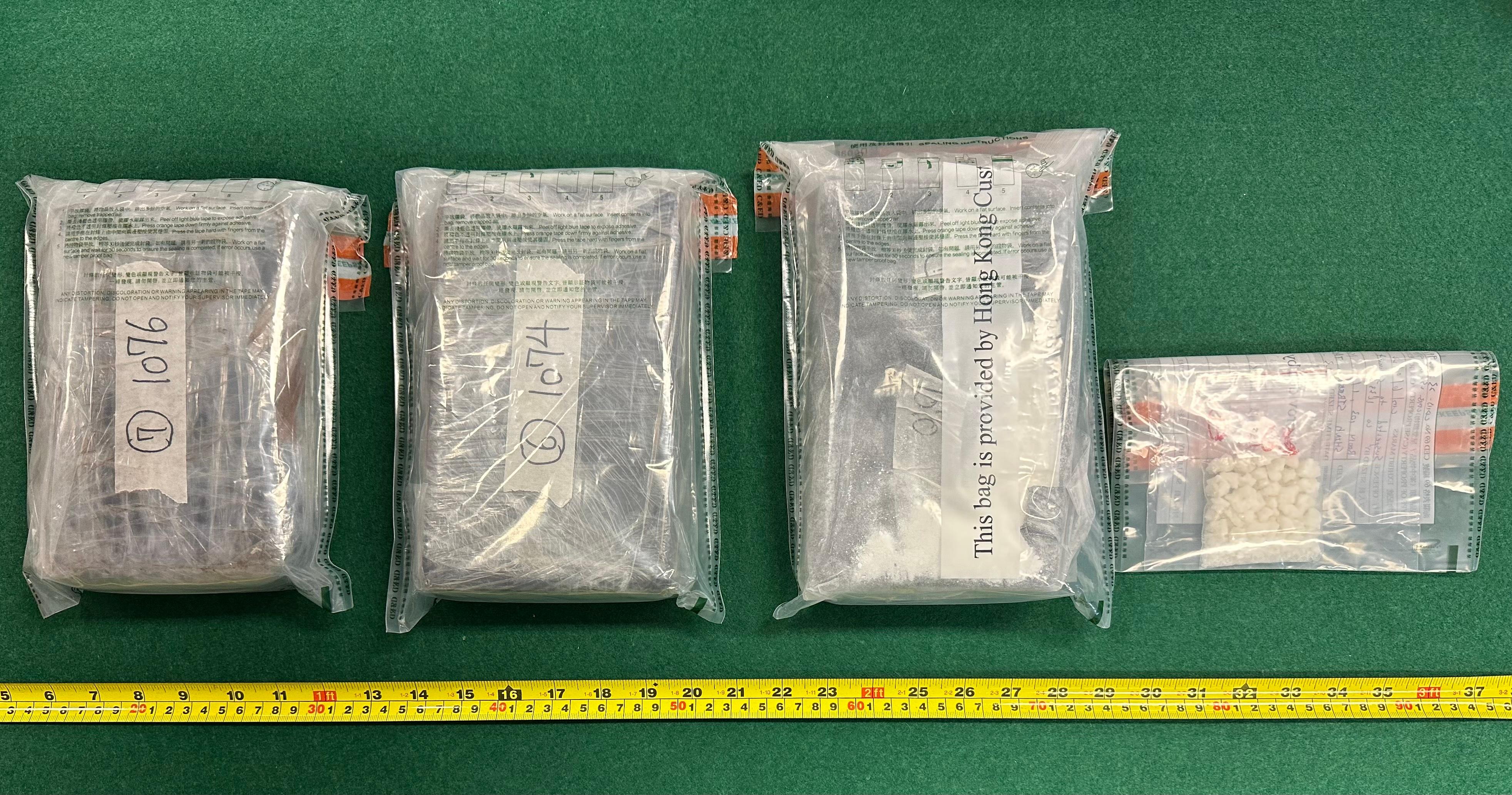 Hong Kong Customs seized about 3 kilograms of suspected cocaine and about 26 grams of suspected crack cocaine with a total estimated market value of about $3.3 million in Tai Koo on May 23. Photo shows the suspected cocaine and suspected crack cocaine seized.