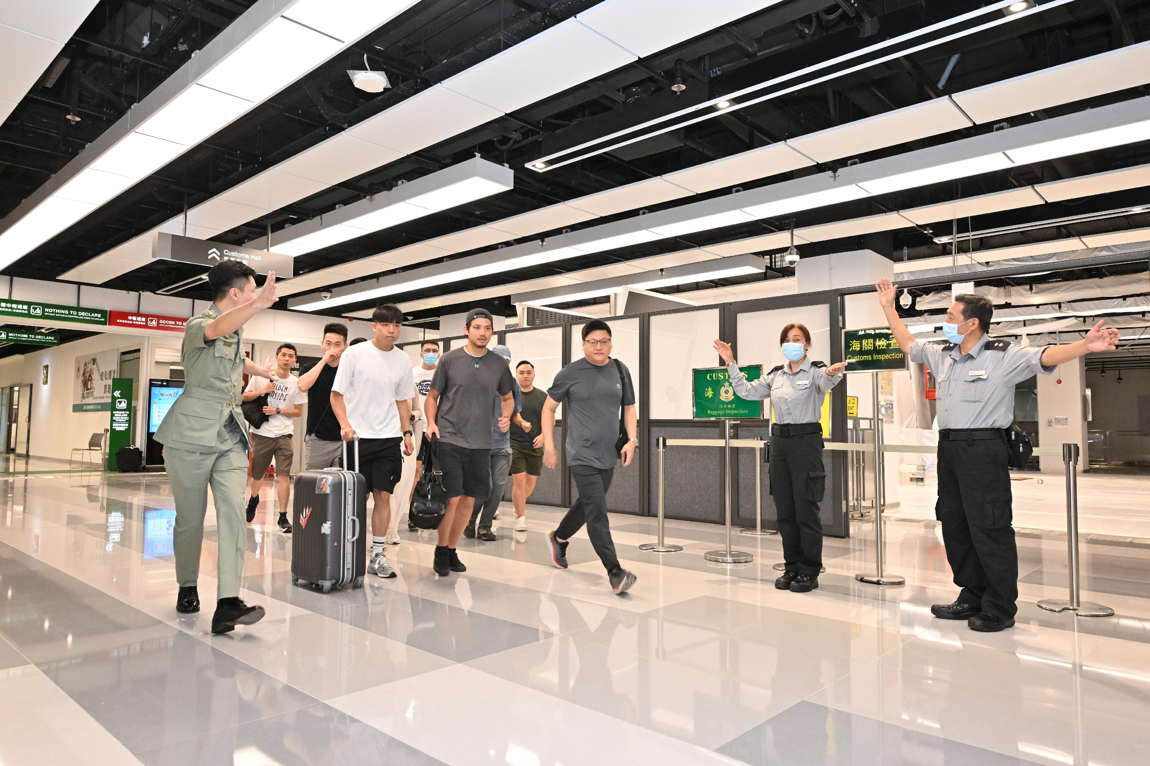 Hong Kong Customs and the Fire Services Department co-organised a counter-terrorism exercise codenamed "GATEKEEPER II" this afternoon (May 30) at the Ocean Terminal. Photo shows Customs officers and on-duty security guards of the Ocean Terminal evacuating people at the scene in an orderly and safe manner.