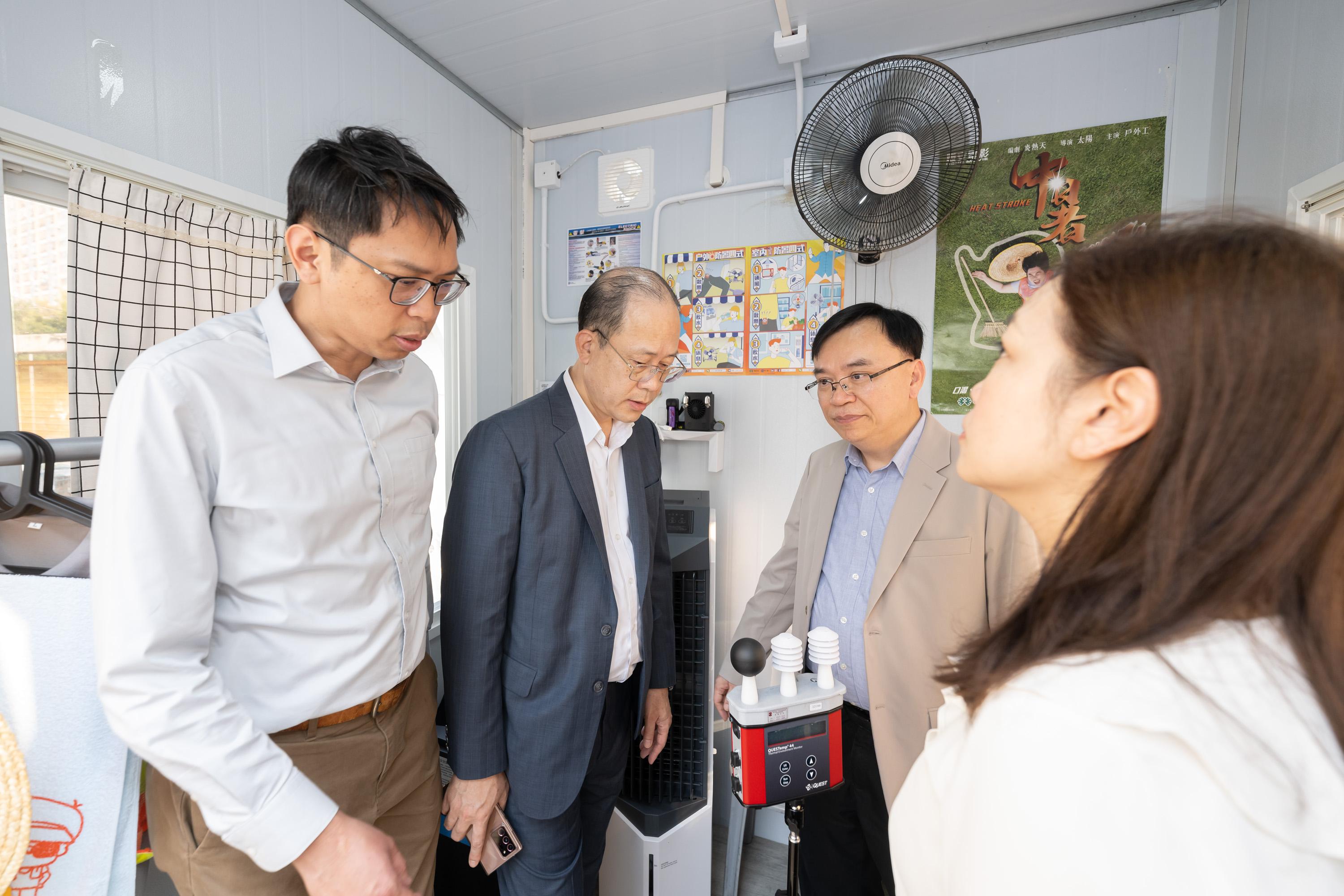 The Legislative Council (LegCo) Panel on Manpower visits the Occupational Safety and Health Academy today (May 30). Photo shows the Chairman of the Panel, Mr Luk Chung-hung (first left), and other LegCo Members visiting the Solar Cooling Kiosk.