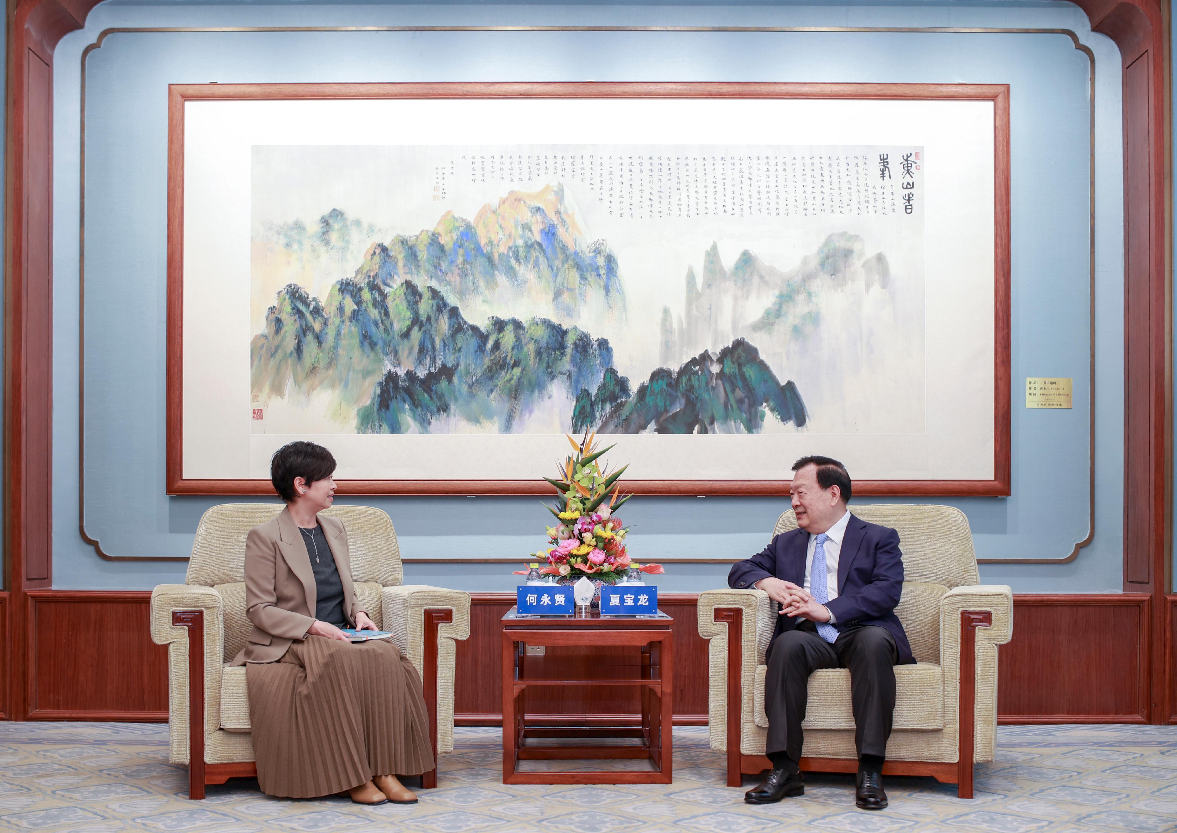 The Secretary for Housing, Ms Winnie Ho, was on the second day of her visit to Beijing today (May 31). Photo shows Ms Ho (left) calling on the Director of the Hong Kong and Macao Affairs Office of the State Council, Mr Xia Baolong (right), in the morning.
