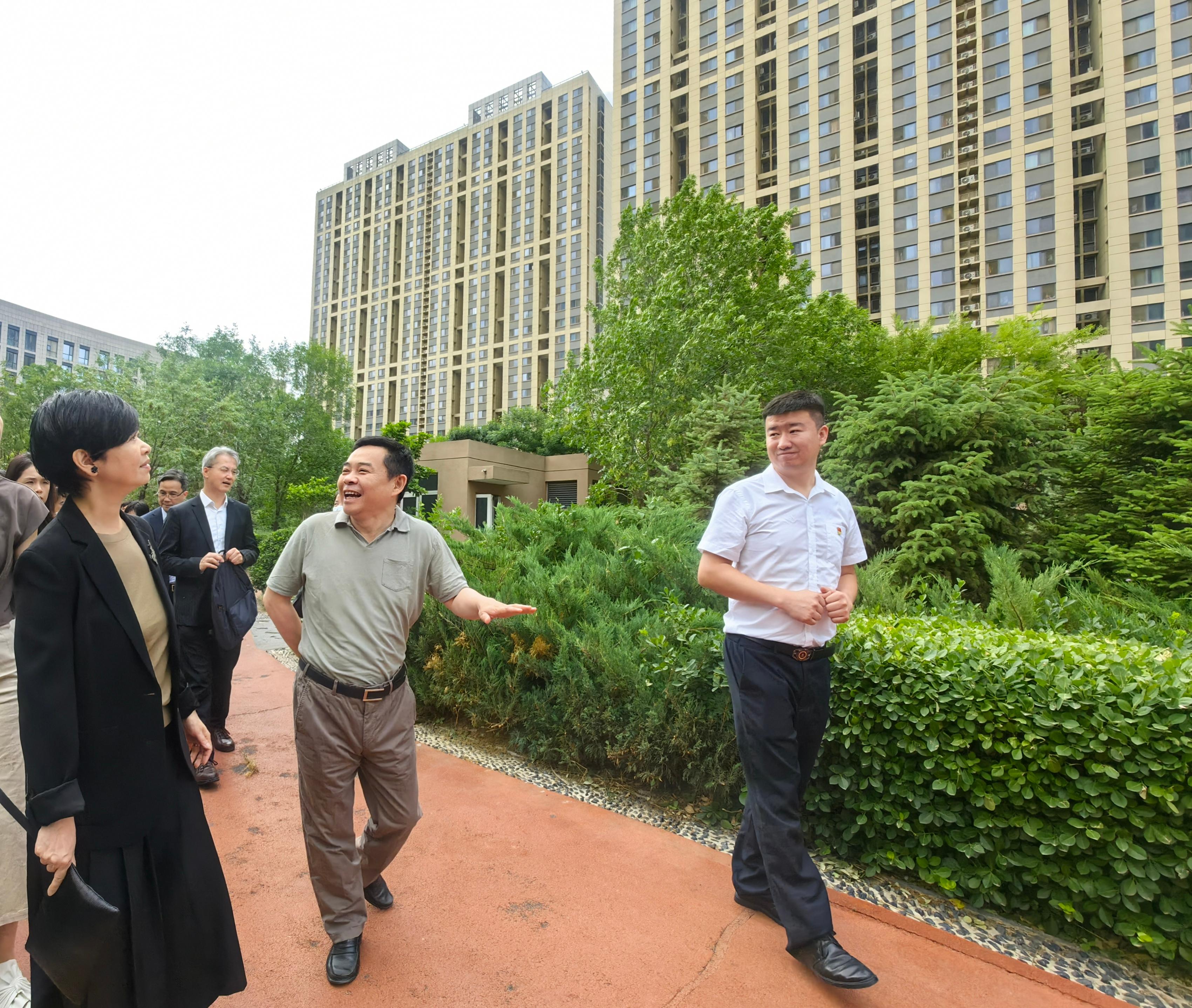 The Secretary for Housing, Ms Winnie Ho, was on the third day of her visit to Beijing today (June 1). Photo shows Ms Ho (first left) visiting indemnificatory housing projects developed by a state-owned enterprise, namely the Beijing Public Housing Center.