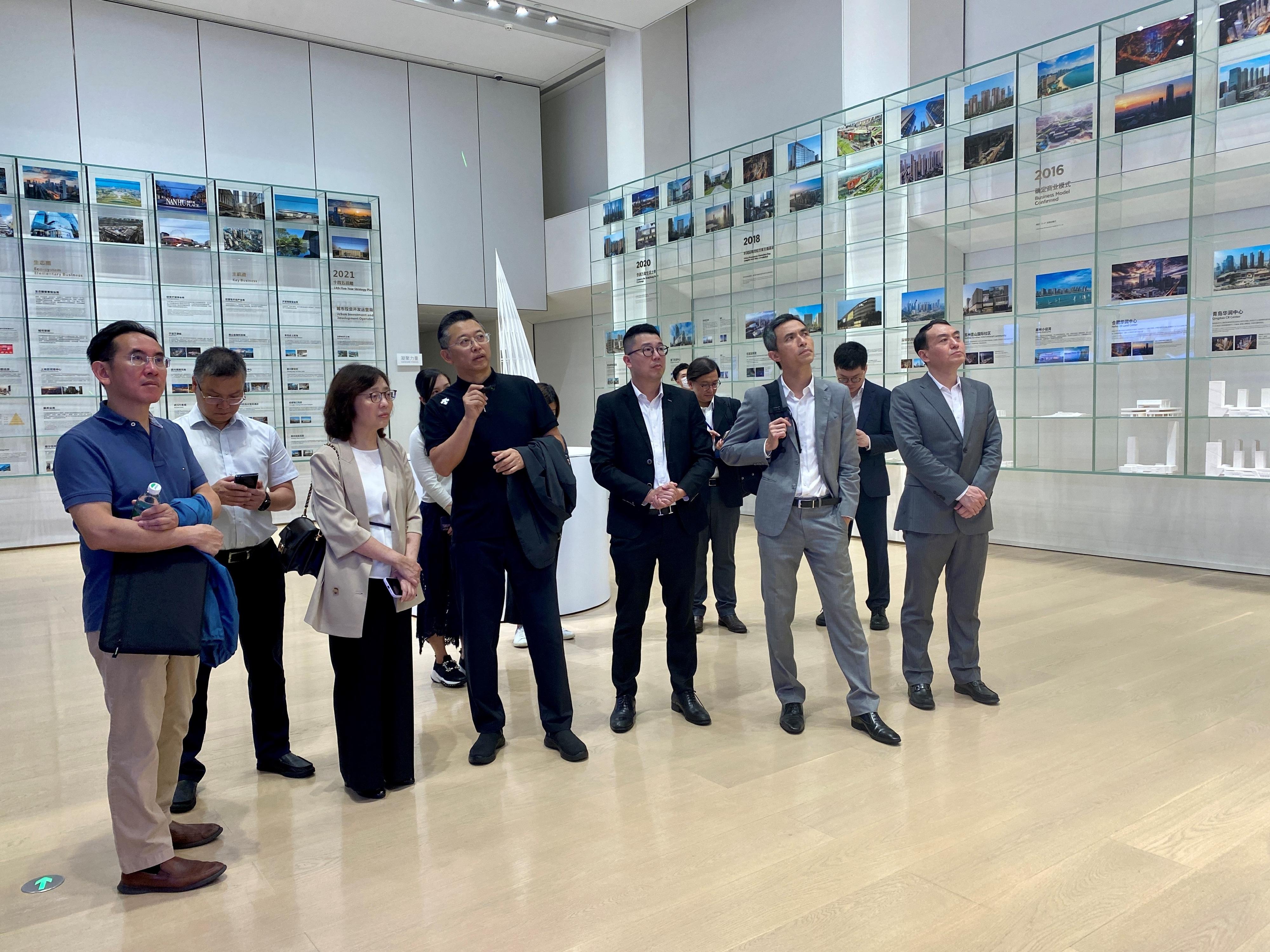 The Secretary for Development, Ms Bernadette Linn, today (June 1) visited Nanshan District in Shenzhen to inspect the development and implementation of local districts in the area. Photo shows Ms Linn (third left); the Under Secretary for Development, Mr David Lam (first left); and the Director of the Preparatory Office for Northern Metropolis, Mr Vic Yau (second right), visiting an exhibition hall of a local district developer and being briefed on its business development.