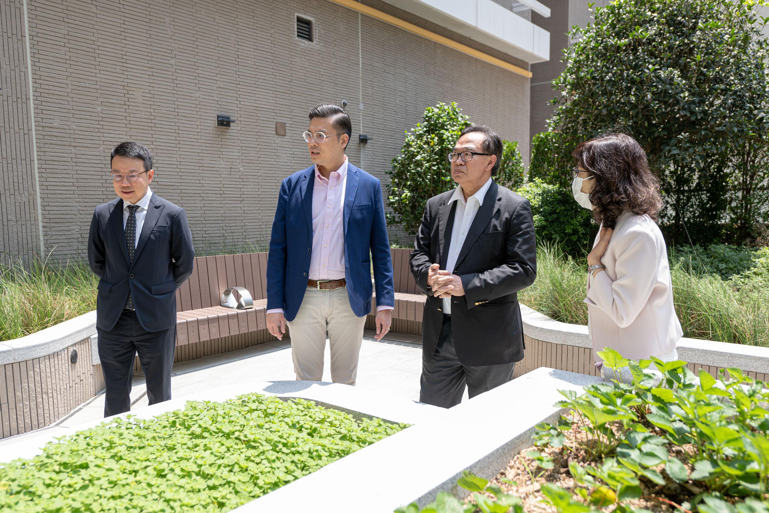 The Legislative Council (LegCo) Panel on Housing visited the Blissful Place of the Hong Kong Housing Society in Hung Hom today (June 2). Photo shows LegCo Members toured the sky garden of the Blissful Place.