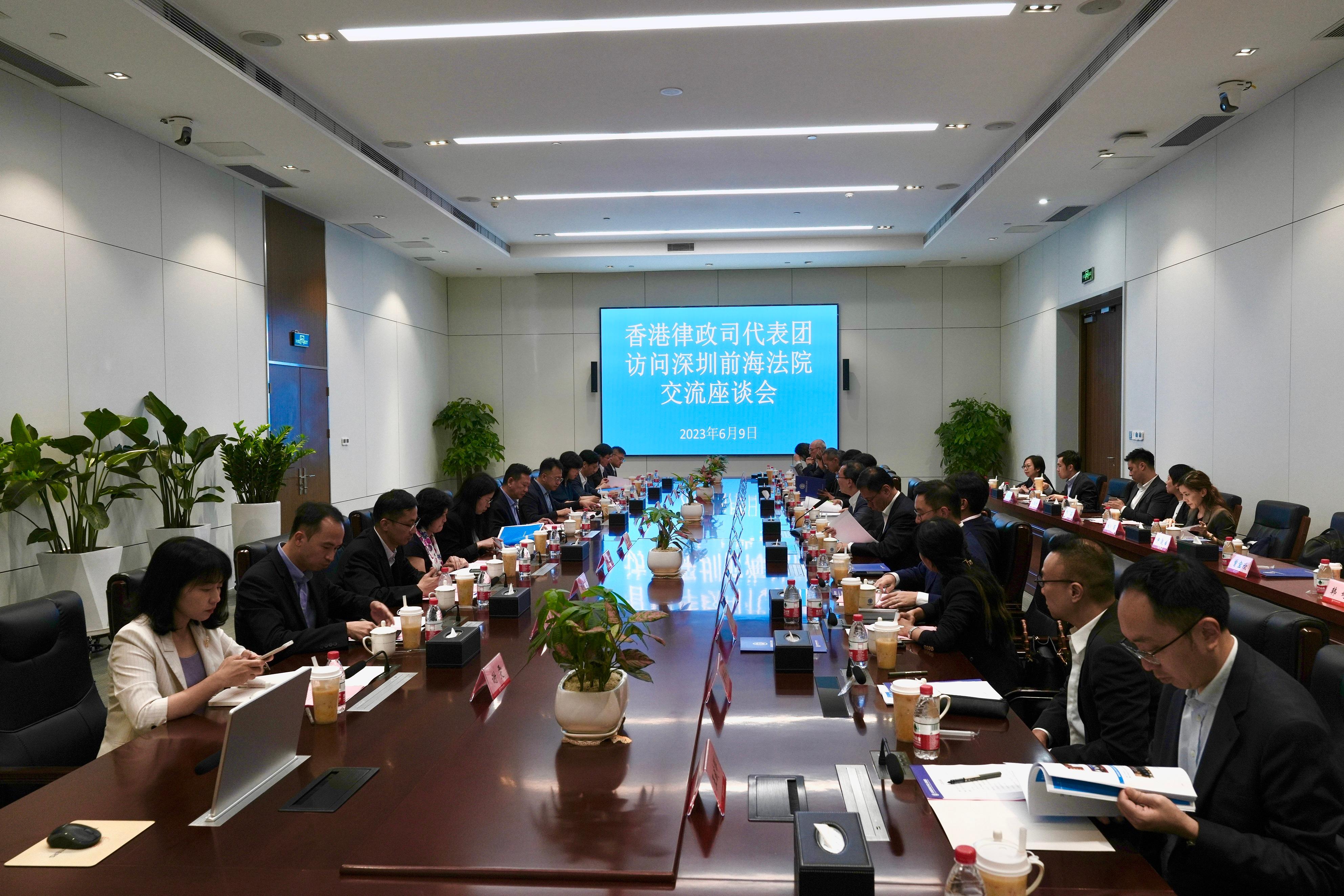 The Secretary for Justice, Mr Paul Lam, SC (seventh right), and the delegation comprising representatives from the Hong Kong legal sector call on the Shenzhen Qianhai Cooperation Zone People's Court (Qianhai Court) and met with the President of the Qianhai Court, Mr Bian Fei (seventh left), on the afternoon of June 9 in Shenzhen. Photo shows both sides in the meeting.

