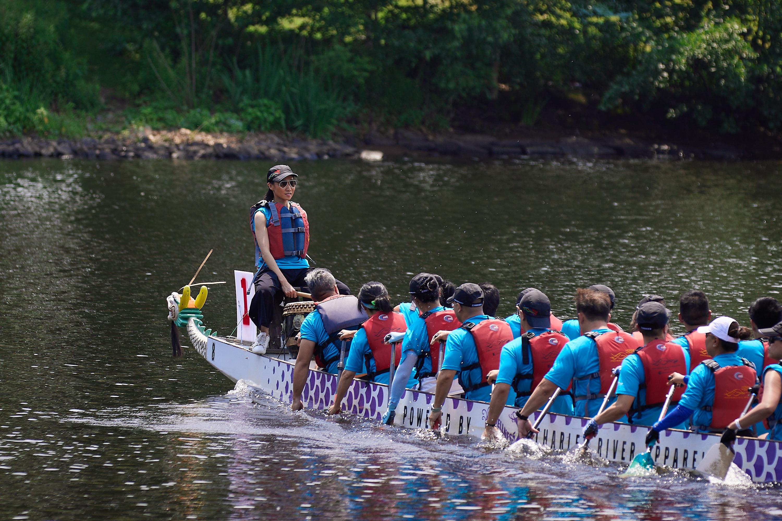 The Director of the Hong Kong Economic and Trade Office in New York (HKETONY), Ms Candy Nip, takes part in the races at the 44th Boston Hong Kong Dragon Boat Festival today (June 11, Boston time) as the drummer for the HKETONY Dragon Riders team.
