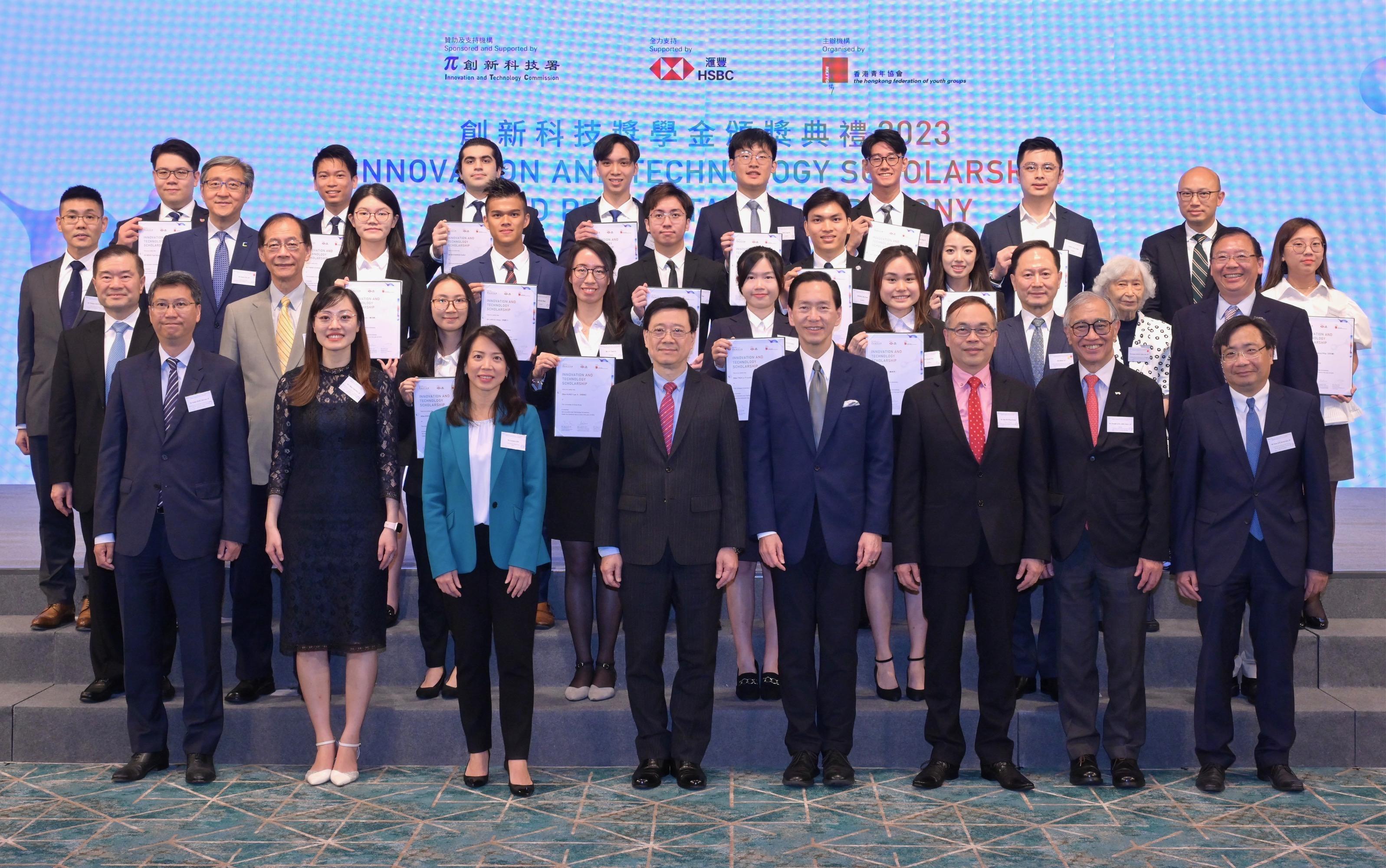 The Chief Executive, Mr John Lee, attended the Innovation and Technology Scholarship Award Presentation Ceremony 2023 today (June 13). Photo shows (first row, from second left) the Acting Secretary for Innovation, Technology and Industry, Ms Lillian Cheong; the Chief Executive, Hong Kong of the Hongkong and Shanghai Banking Corporation Limited, Ms Luanne Lim; Mr Lee; the Chairman of the Awardee Selection Committee of the Innovation and Technology Scholarship, Mr Bernard Chan; the Executive Director of the Hong Kong Federation of Youth Groups, Mr Andy Ho; the Chairman of the Scholarship Administration Committee of the Innovation and Technology Scholarship, Dr Joseph Lee, and other guests with the awardees.