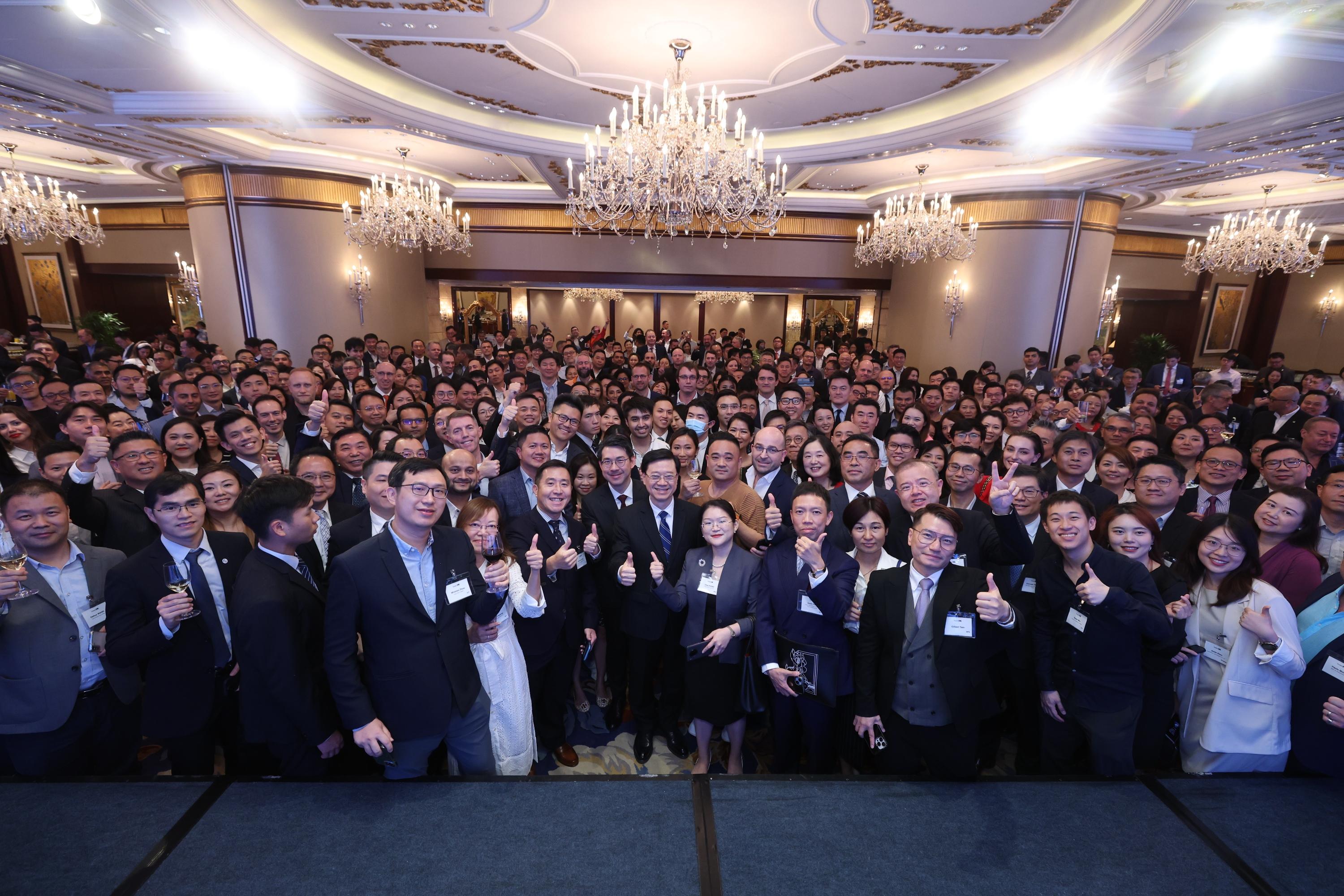 The Chief Executive, Mr John Lee (first row, sixth right), is pictured with guests at an Invest Hong Kong reception today (June 15).