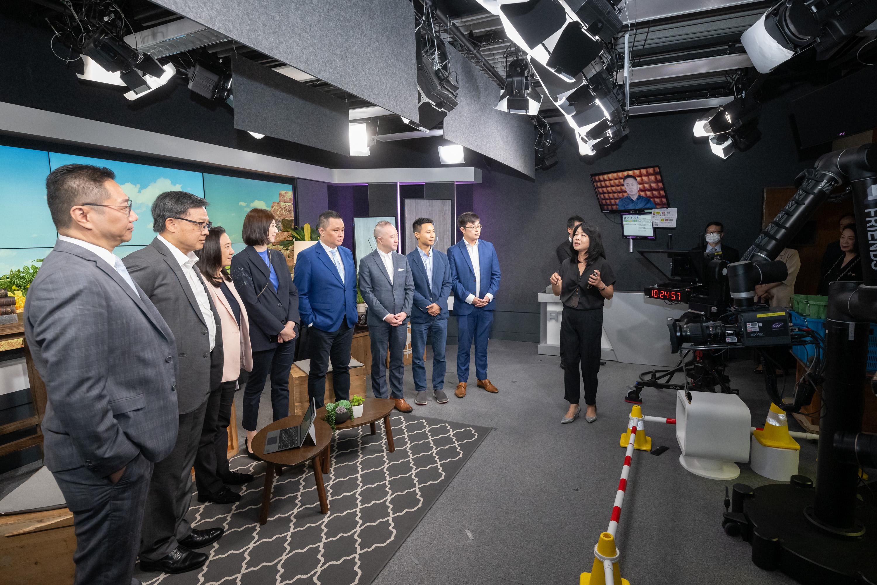 The Legislative Council (LegCo) Panel on Information Technology and Broadcasting visits Radio Television Hong Kong today (June 16) to enhance Members' understanding of the work of the public service broadcaster. Photo shows the Chairman of the Panel, Dr Junius Ho (second left), and other LegCo Members visiting a radio production studio equipped to broadcast on TV at Broadcasting House.