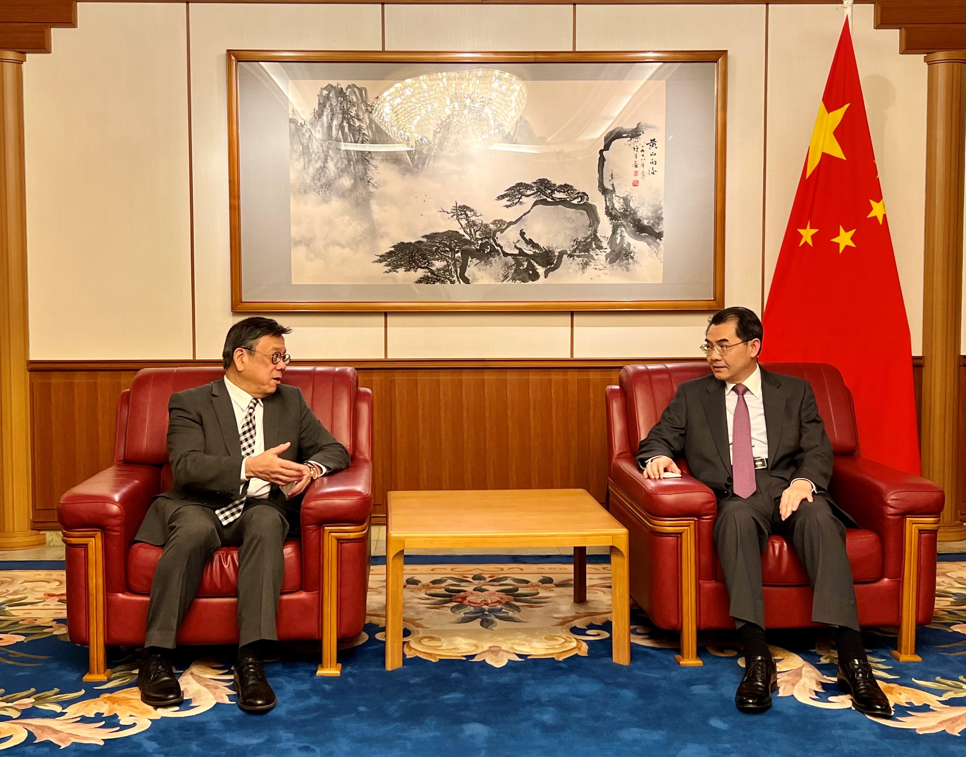 The Secretary for Commerce and Economic Development, Mr Algernon Yau (left), pays a courtesy call on the Chinese Ambassador to Japan, Mr Wu Jianghao (right), in Tokyo, Japan, today (June 19), to give him an update on Hong Kong's latest developments. 