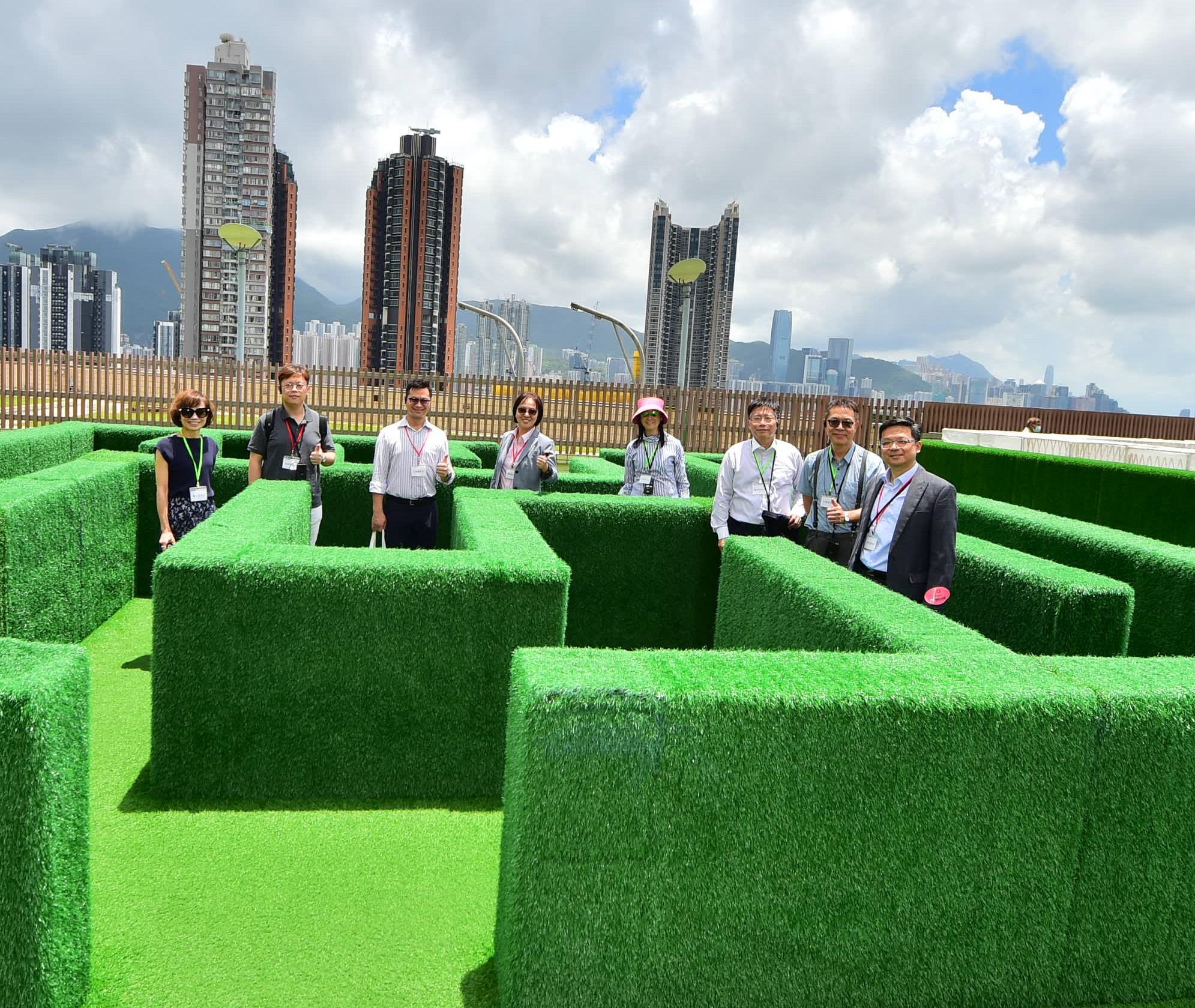 Members of the Hong Kong Housing Authority (HA) and its Commercial Properties Committee (CPC) today (June 20) visited the HA's flagship shopping mall, Domain, in Yau Tong. Photo shows the Chairman of the CPC, Ms Serena Lau (fourth left), and members of the HA/CPC visiting the new addition of a labyrinth park at the rooftop garden of Domain.