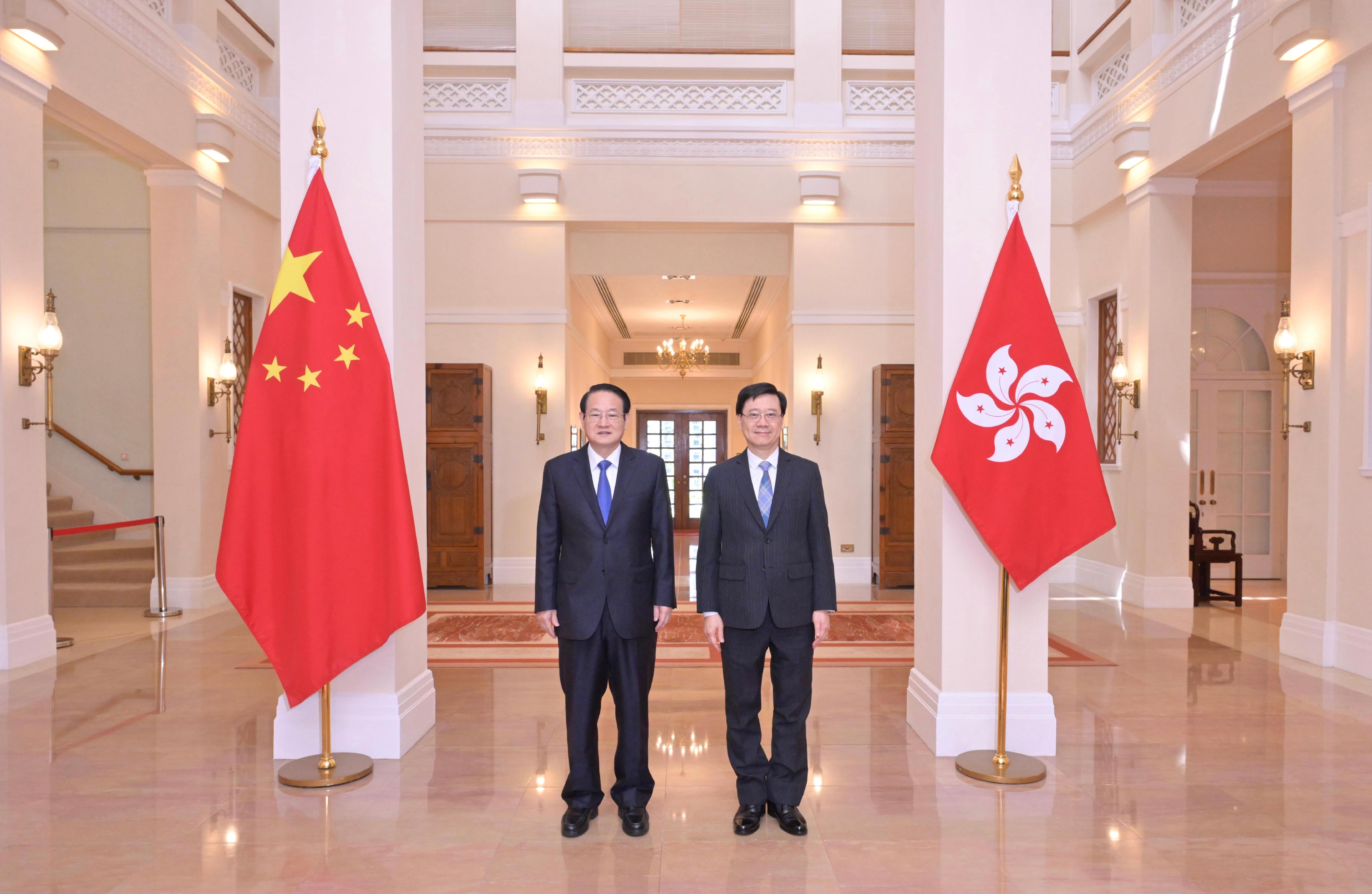 The Chief Executive, Mr John Lee (right), met with the Secretary of the CPC Zhejiang Provincial Committee, Mr Yi Lianhong (left), at Government House today (June 26).
