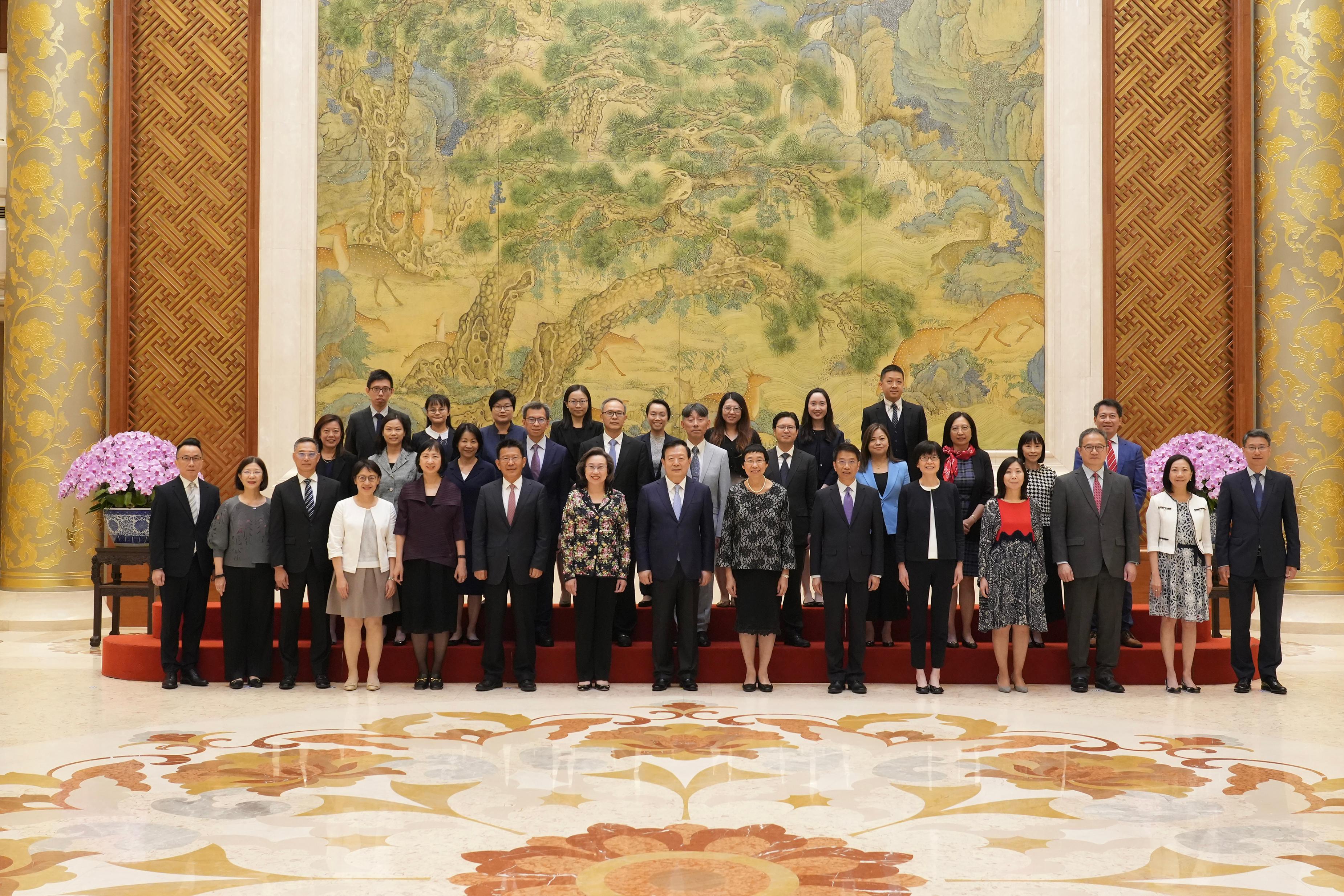 The Director of the Hong Kong and Macao Affairs Office of the State Council, Mr Xia Baolong (front row, centre), took a group photo with the delegation of HKSAR Government’s Permanent Secretaries and Heads of Departments for study and duty visit this afternoon (June 26).
