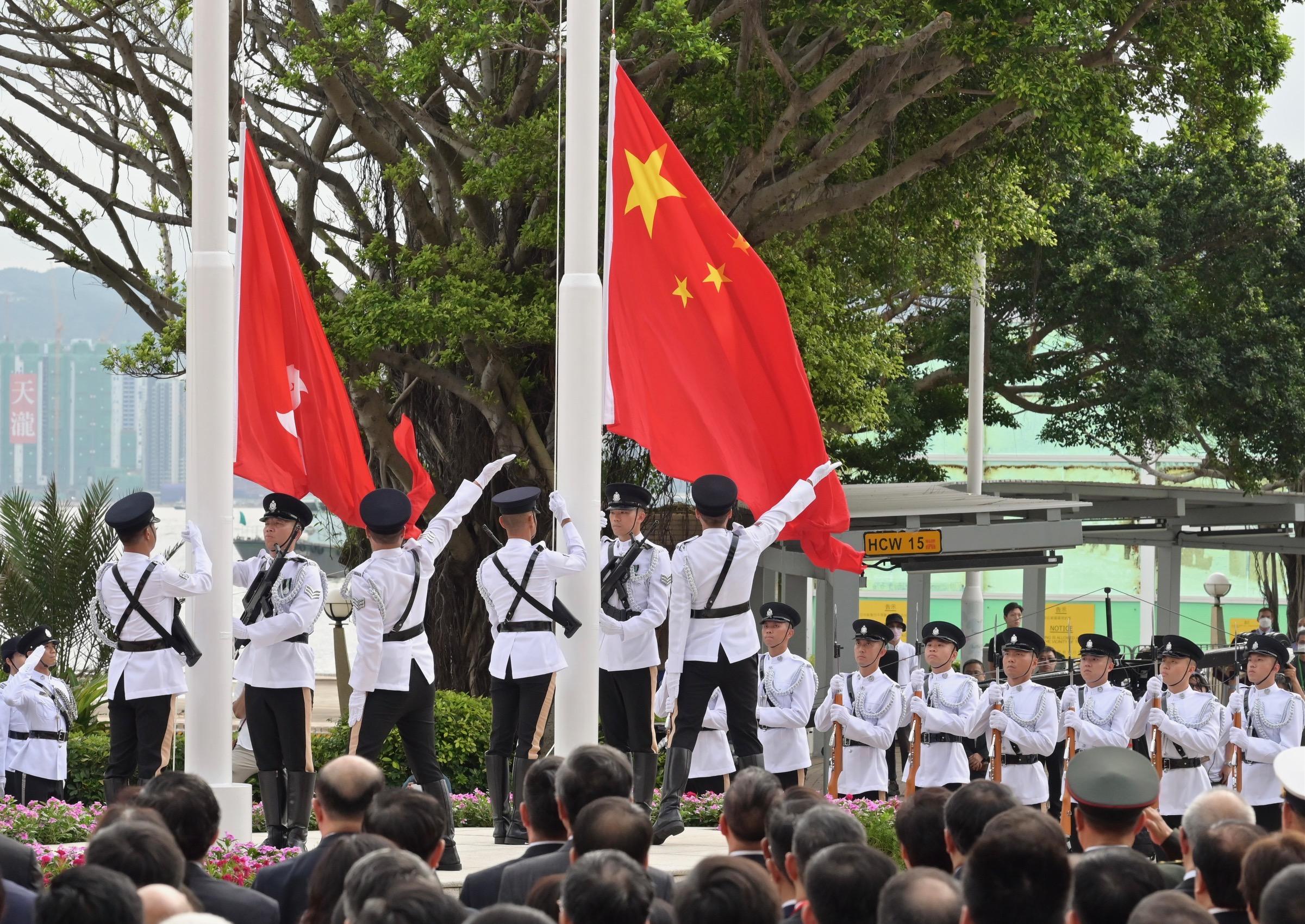 The National and Regional flags are raised at the flag-raising ceremony for the 26th anniversary of the establishment of the Hong Kong Special Administrative Region at Golden Bauhinia Square in Wan Chai this morning (July 1).