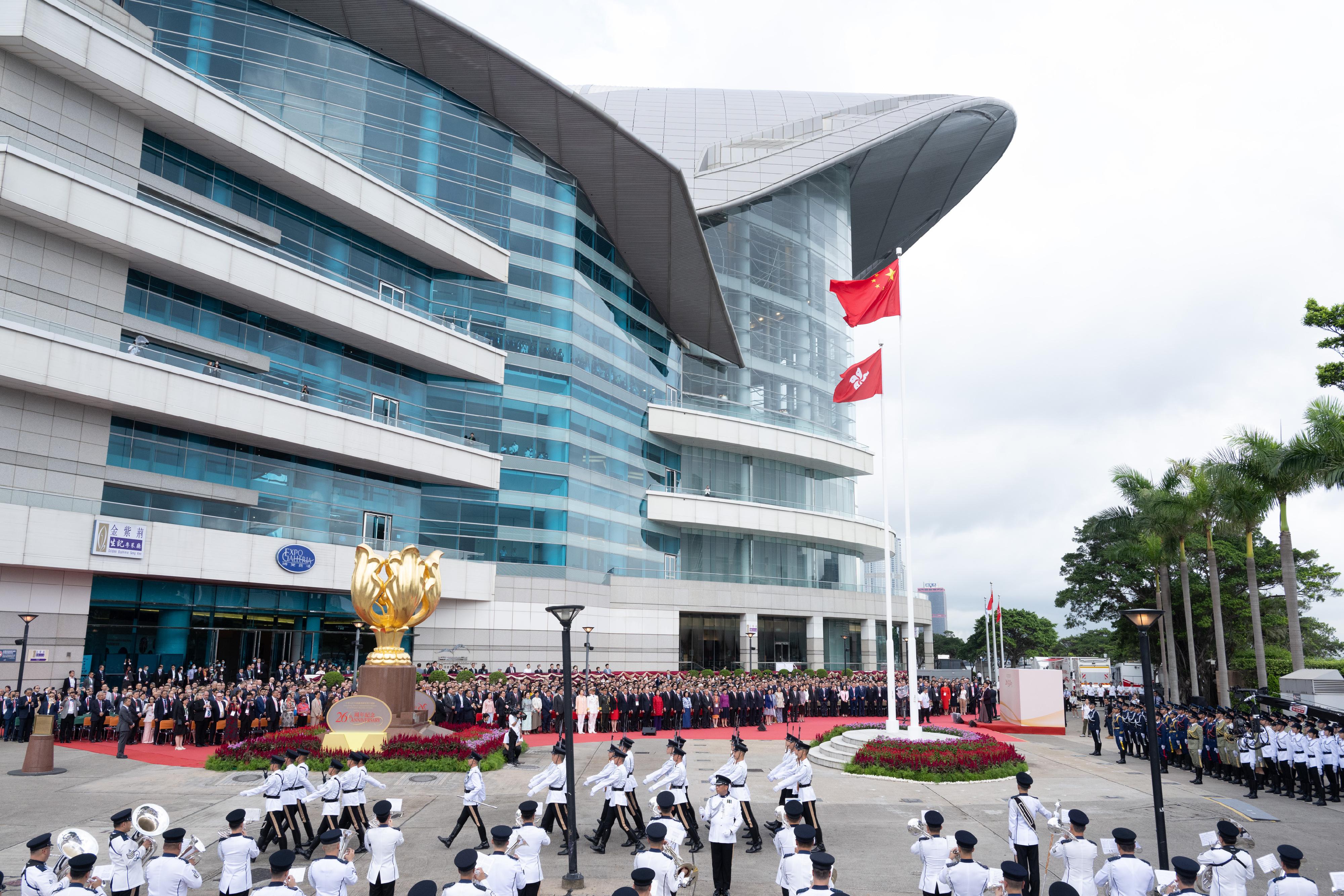 The Chief Executive, Mr John Lee, together with Principal Officials and guests, attends the flag-raising ceremony for the 26th anniversary of the establishment of the Hong Kong Special Administrative Region at Golden Bauhinia Square in Wan Chai this morning (July 1).