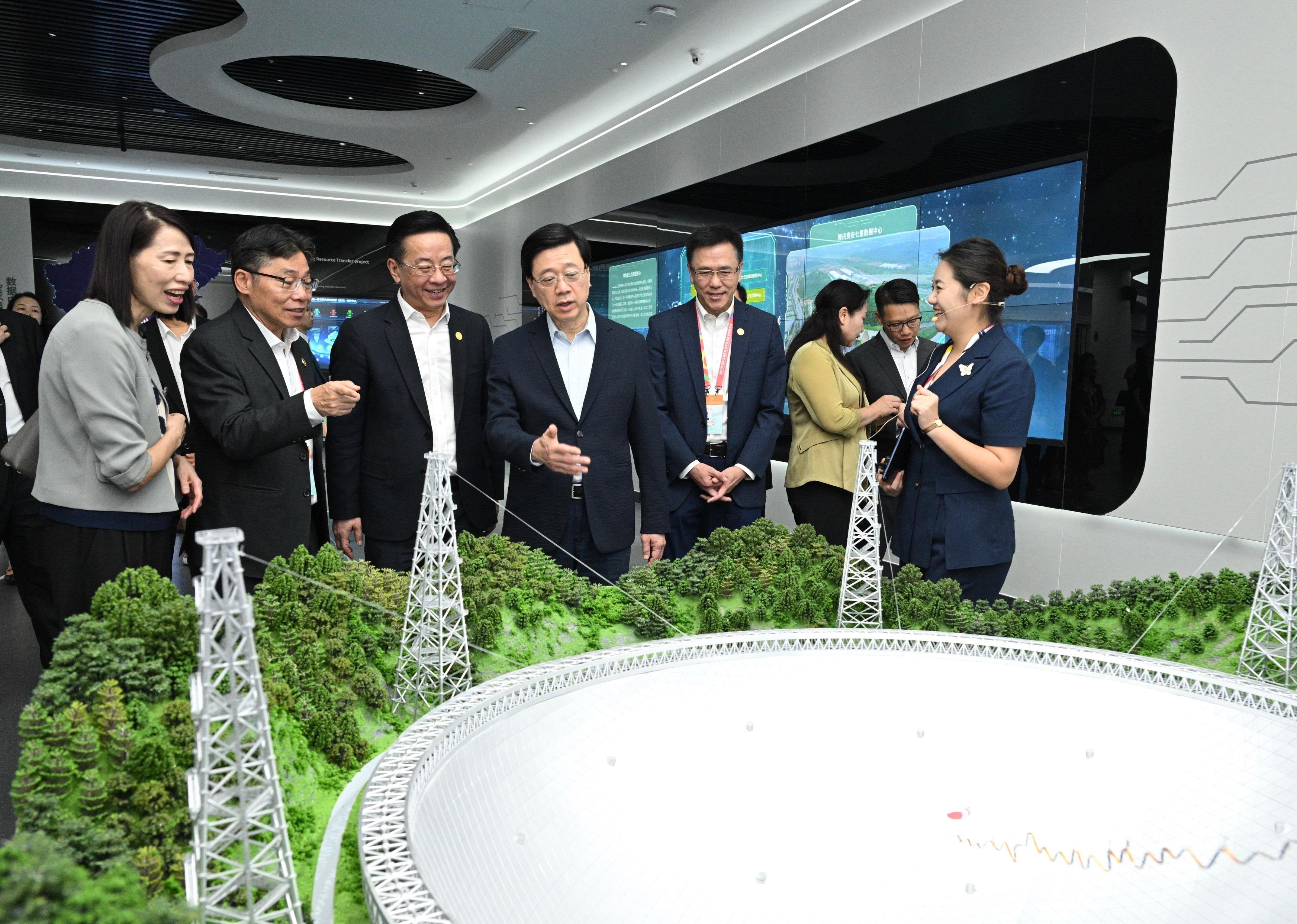 The Chief Executive, Mr John Lee, led a delegation to start his visit programme in Guiyang, today (July 6). Photo shows (from left) the Director of the Chief Executive's Office, Ms Carol Yip; the Secretary for Transport and Logistics, Mr Lam Sai-hung; member of the Standing Committee and Head of the Publicity Department of the Guizhou CPC Provincial Committee, Mr Lu Yongzheng; Mr Lee; and the Secretary for Innovation, Technology and Industry, Professor Sun Dong,  listening to the introduction of the development of the data centre during the visit to the National Big Data (Guizhou) Comprehensive Pilot Zone Communication and Experience Center.