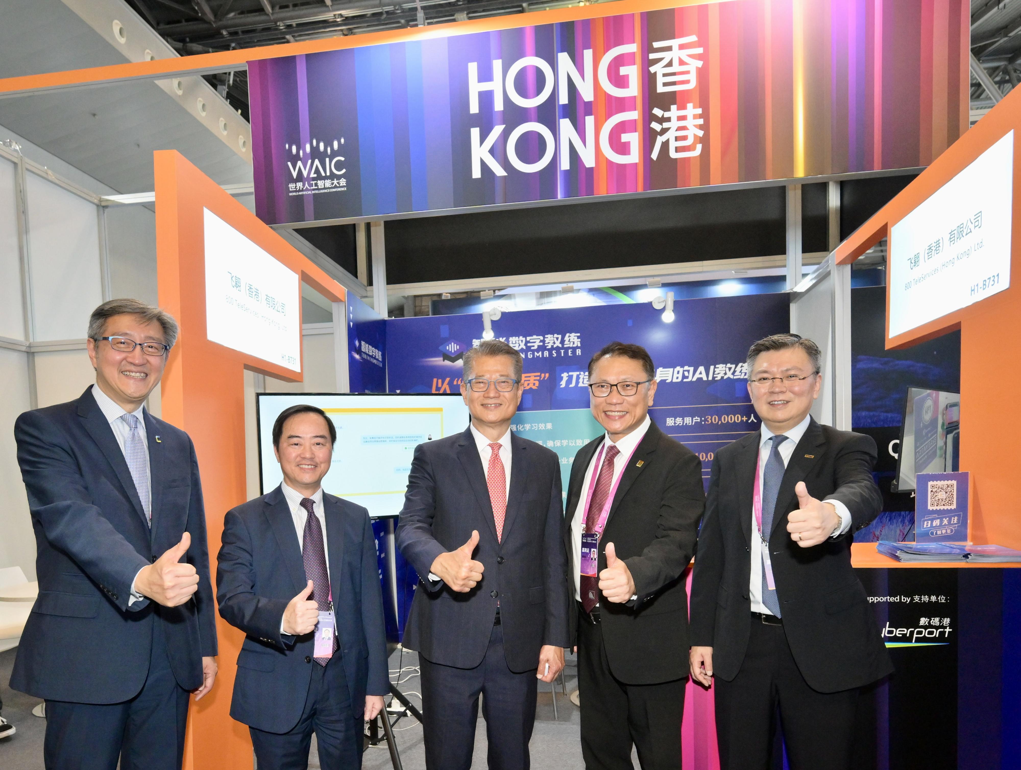 The Financial Secretary, Mr Paul Chan, continued his visit in Shanghai today (July 6). Photo shows Mr Chan (centre) visiting the Hong Kong Pavilion of an exhibition held under the World Artificial Intelligence Conference 2023.