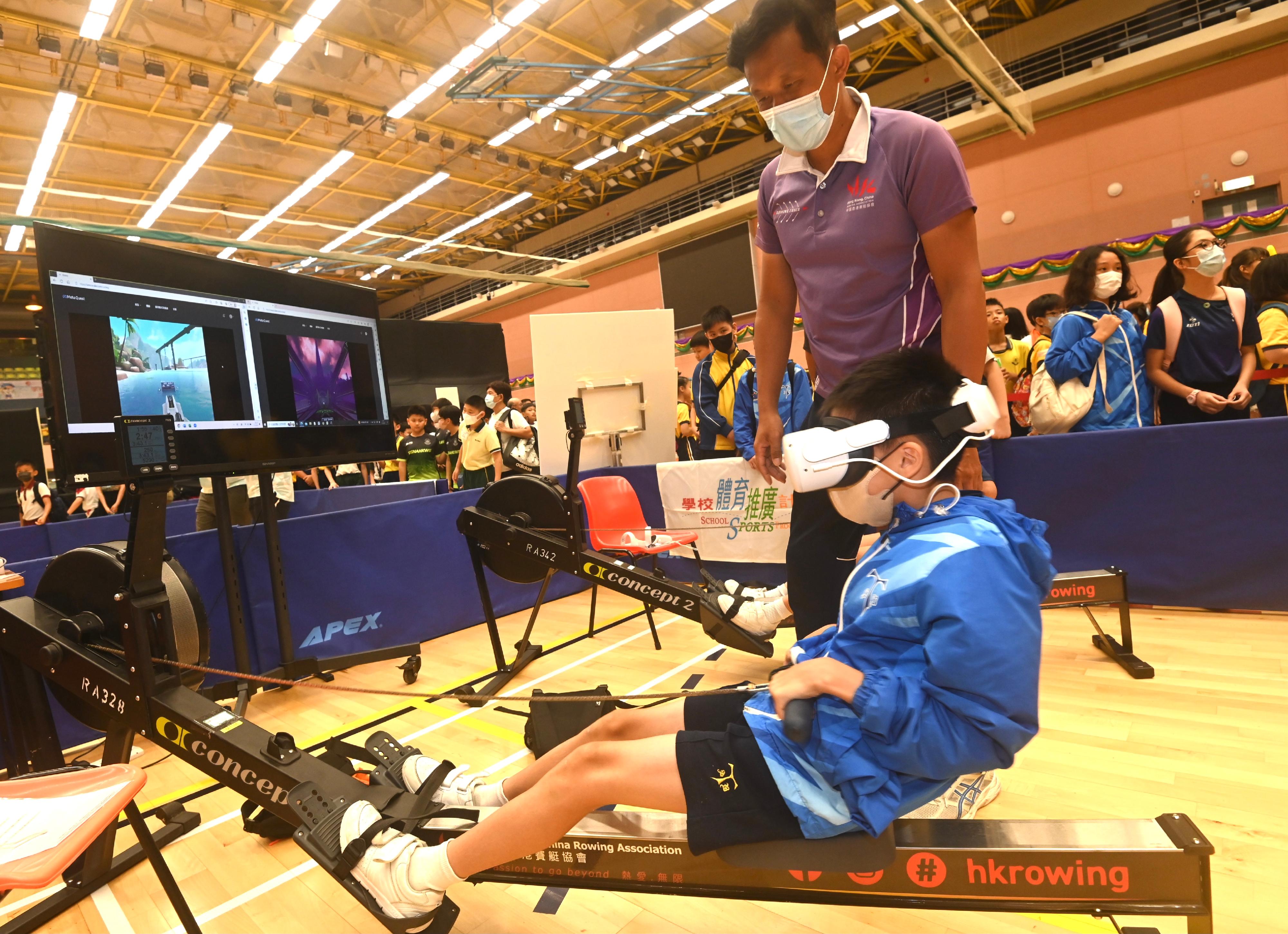 The Leisure and Cultural Services Department held the 2023 School Sports Programme Prize Presentation Ceremony cum Carnival at the Sun Yat Sen Memorial Park Sports Centre today (July 7). Photo shows a student participating in an indoor rowing play-in session.