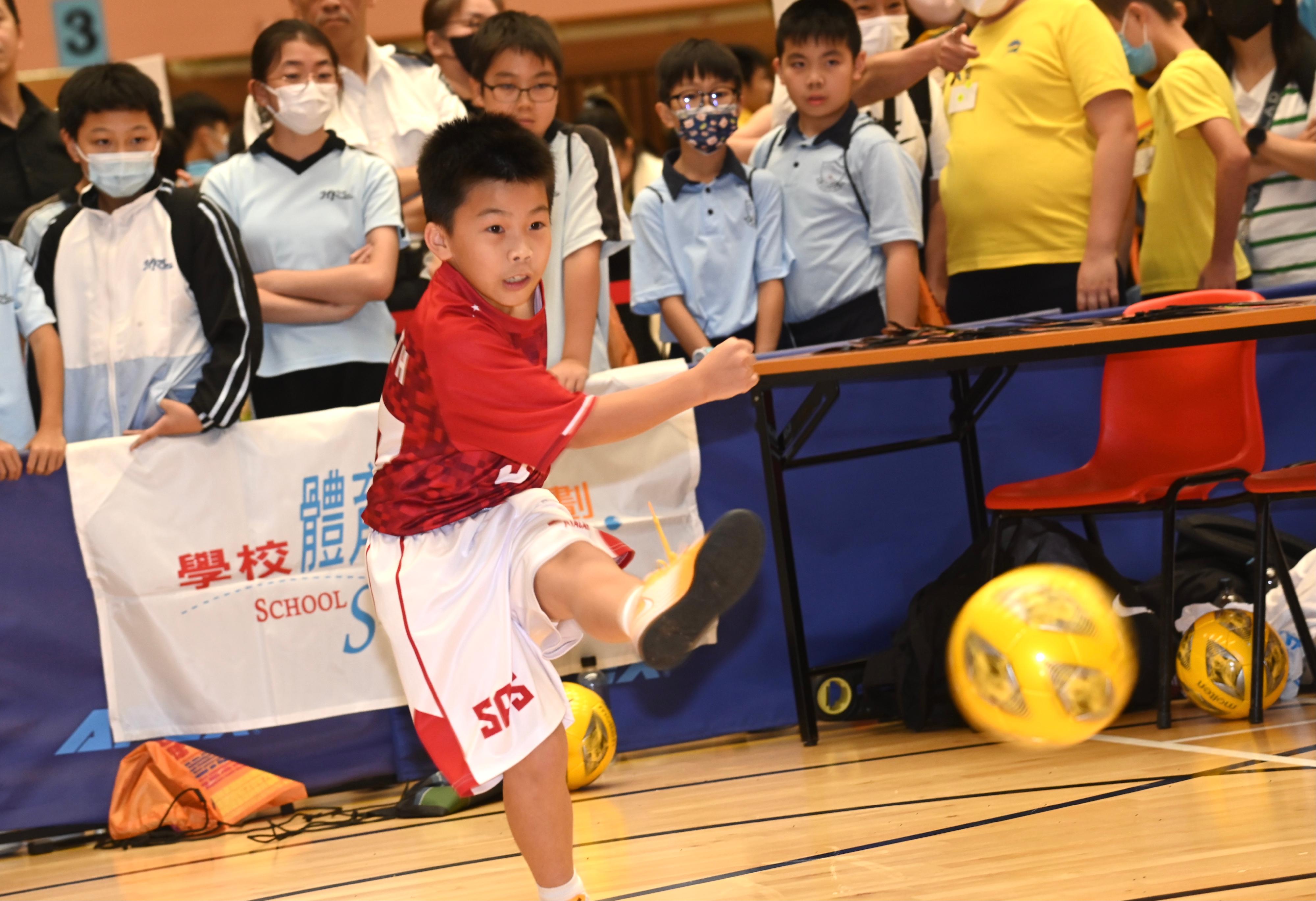 The Leisure and Cultural Services Department held the 2023 School Sports Programme Prize Presentation Ceremony cum Carnival at the Sun Yat Sen Memorial Park Sports Centre today (July 7). Photo shows a student participating in a futsal play-in session.