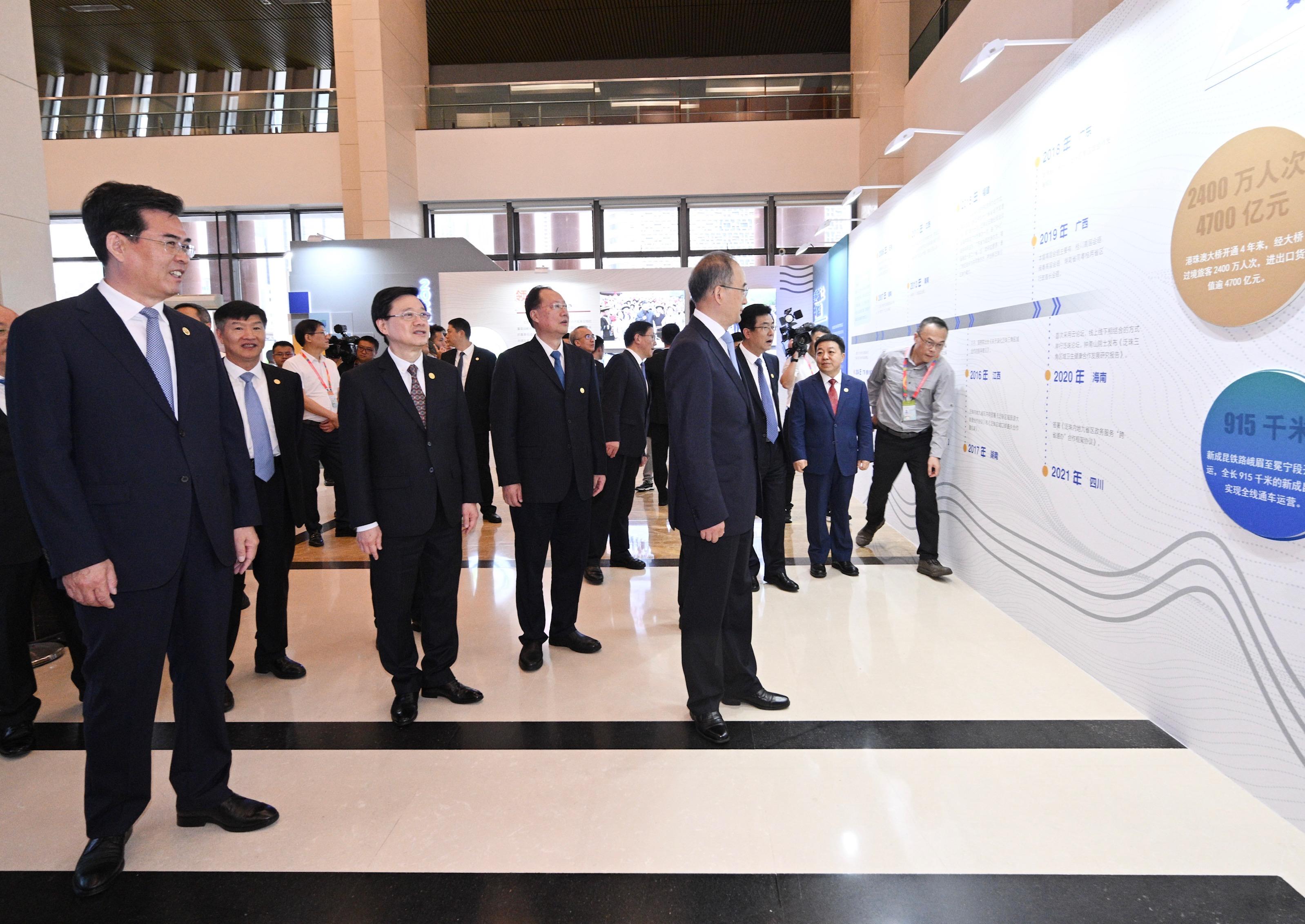 The Chief Executive, Mr John Lee, led a delegation of the Hong Kong Special Administrative Region Government to attend the 2023 Pan-Pearl River Delta Regional Co-operation Chief Executive Joint Conference in Guiyang today (July 7). Photo shows Mr Lee (third left) visiting a photo exhibition on the Conference.