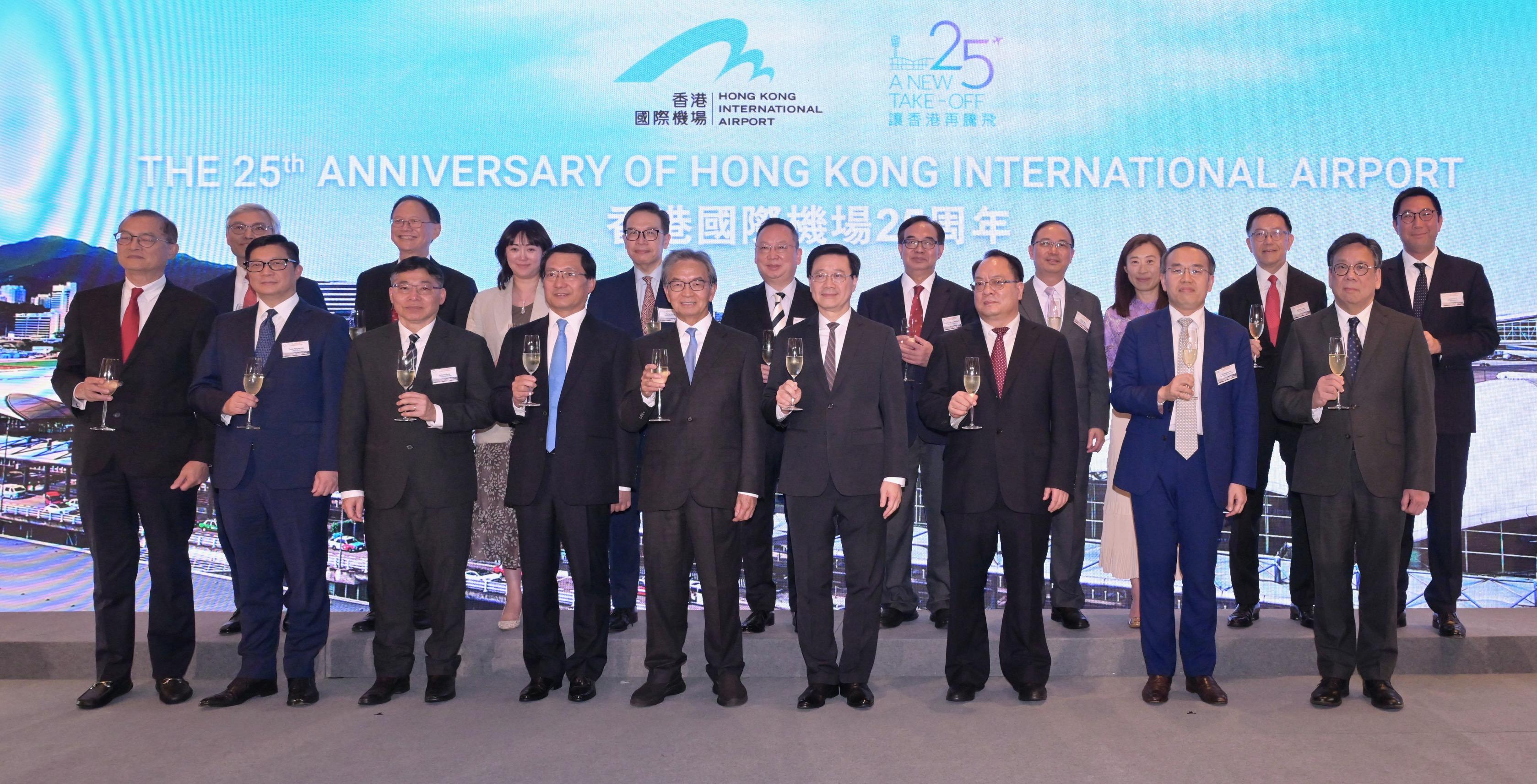 The Chief Executive, Mr John Lee, attended the cocktail reception in celebration of the 25th anniversary of Hong Kong International Airport today (July 10). Photo shows Mr Lee (front row, fourth right); Deputy Commissioner of the Office of the Commissioner of the Ministry of Foreign Affairs of the People's Republic of China in the Hong Kong Special Administrative Region Mr Pan Yundong (front row, third right); the Chairman of the Airport Authority Hong Kong (AAHK), Mr Jack So (front row, fifth left); the Chief Executive Officer of the AAHK, Mr Fred Lam (front row, fourth left), and other guests at the reception.
