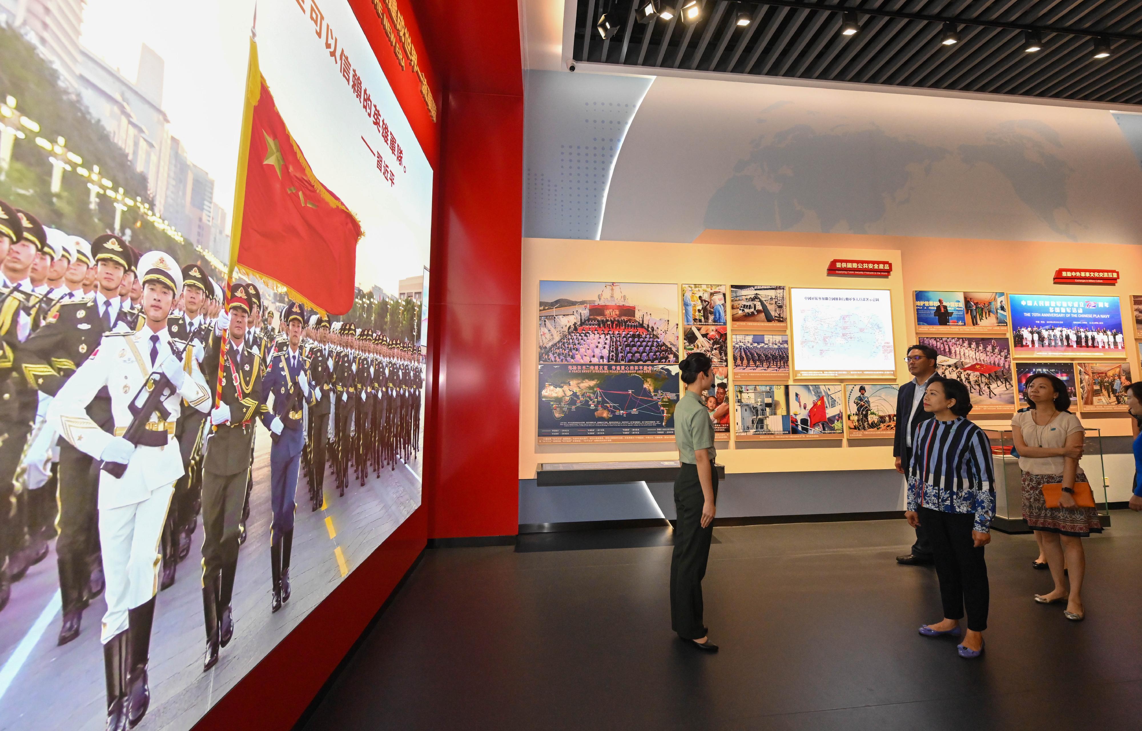 The Secretary for Home and Youth Affairs, Miss Alice Mak (second left); the Permanent Secretary for Home and Youth Affairs, Ms Shirley Lam (fourth left); and the Under Secretary for Home and Youth Affairs, Mr Clarence Leung (third left), today (July 11) visited the Chinese People's Liberation Army Hong Kong Garrison Exhibition Center at Ngong Shuen Chau Barracks, and received a briefing on the exhibits from an official of the Chinese People's Liberation Army Hong Kong Garrison.
