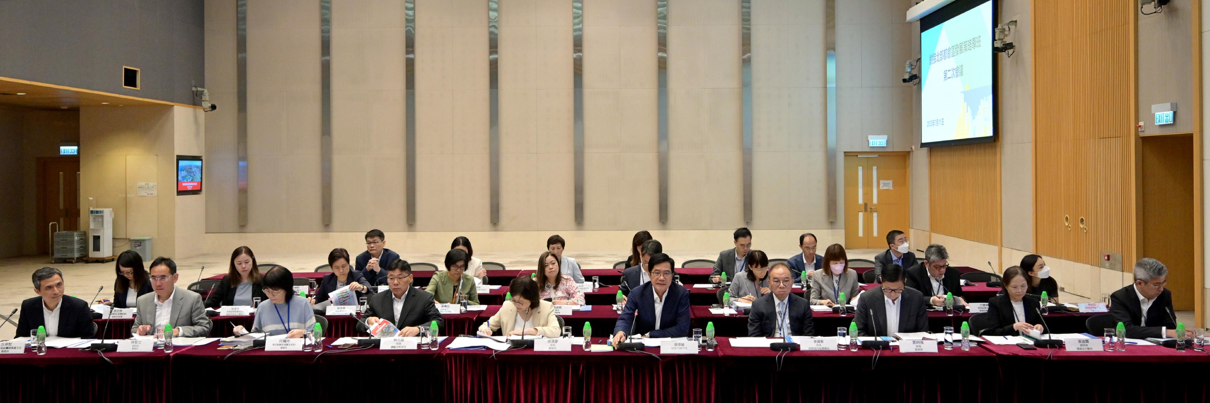 The Deputy Financial Secretary, Mr Michael Wong (first row, fifth right), and Vice Mayor of Shenzhen Municipal People's Government Mr Huang Min, leading delegations of the governments of the Hong Kong Special Administrative Region and Shenzhen respectively, held the second meeting of the Task Force for Collaboration on the Northern Metropolis Development Strategy in Hong Kong today (July 11). Also attending are the Secretary for Development, Ms Bernadette Linn (first row, fifth left); the Secretary for Constitutional and Mainland Affairs, Mr Erick Tsang Kwok-wai (first row, fourth right); the Secretary for Transport and Logistics, Mr Lam Sai-hung (first row, fourth left); the Secretary for Security, Mr Tang Ping-keung (first row, third right); the Under Secretary for Environment and Ecology, Miss Diane Wong (first row, second right); the Under Secretary for Culture, Sports and Tourism, Mr Raistlin Lau (first row, first right); the Permanent Secretary for Development (Planning & Lands), Ms Doris Ho (first row, third left); the Under Secretary for Development, Mr David Lam (first row, second left); and the Director of Northern Metropolis Co-ordination Office, Mr Vic Yau (first row, first left).