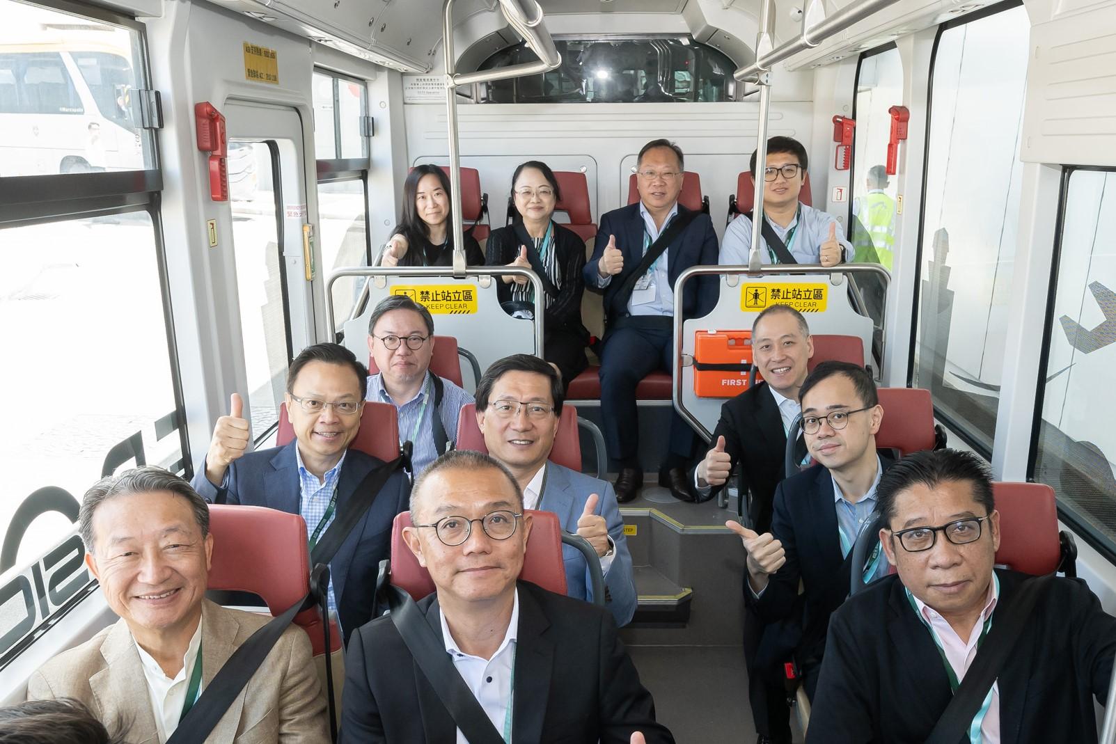 The Legislative Council (LegCo) Panel on Economic Development visited the Hong Kong International Airport (HKIA) today (July 11). Photo shows LegCo Members taking a ride on the autonomous vehicle and receiving a briefing by the representatives of Airport Authority Hong Kong on the operation of autonomous vehicles at HKIA.