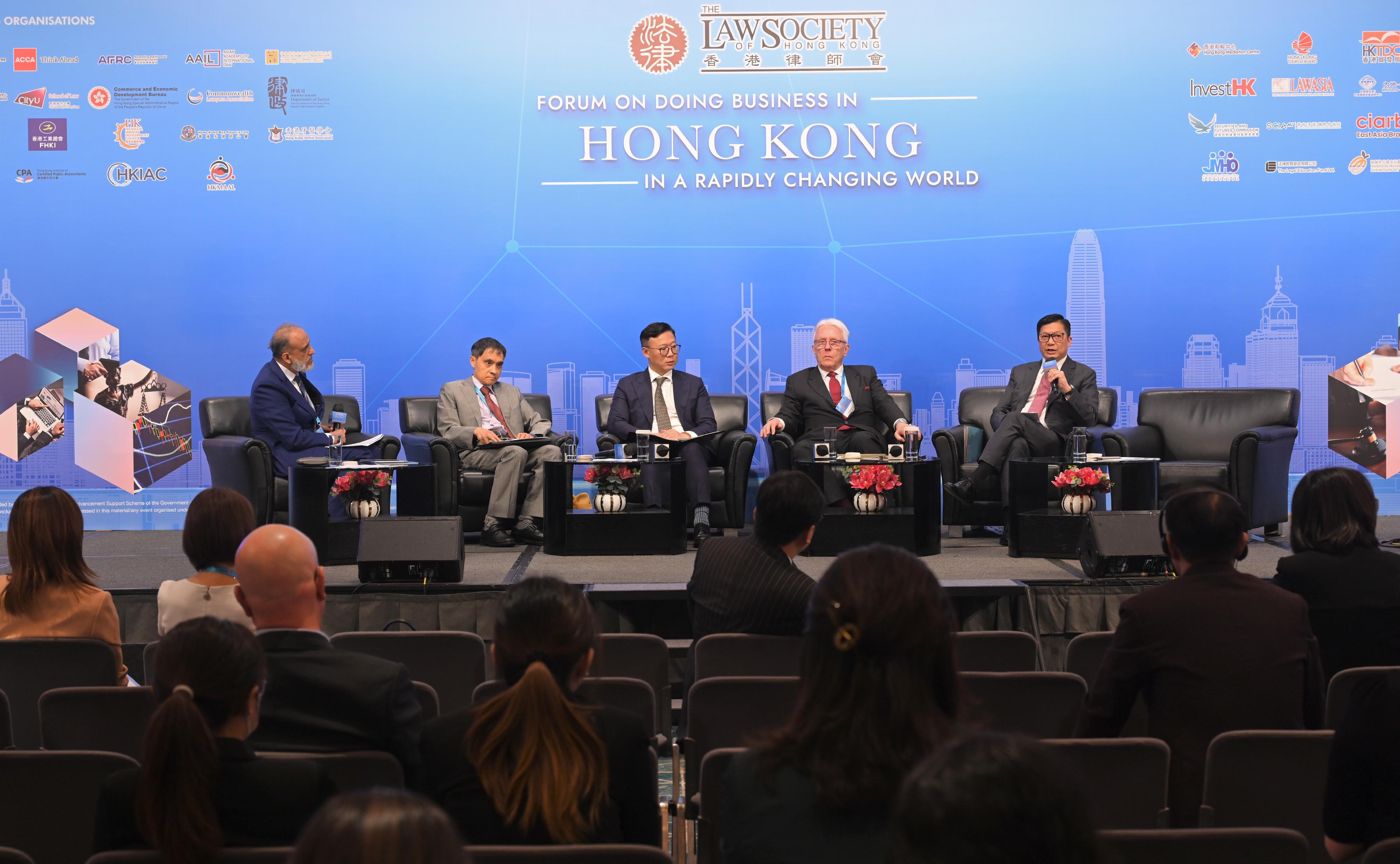 The Secretary for Security, Mr Tang Ping-keung (first right), speaks at a panel discussion at the Law Society of Hong Kong's Forum on Doing Business in Hong Kong in a Rapidly Changing World today (July 11).