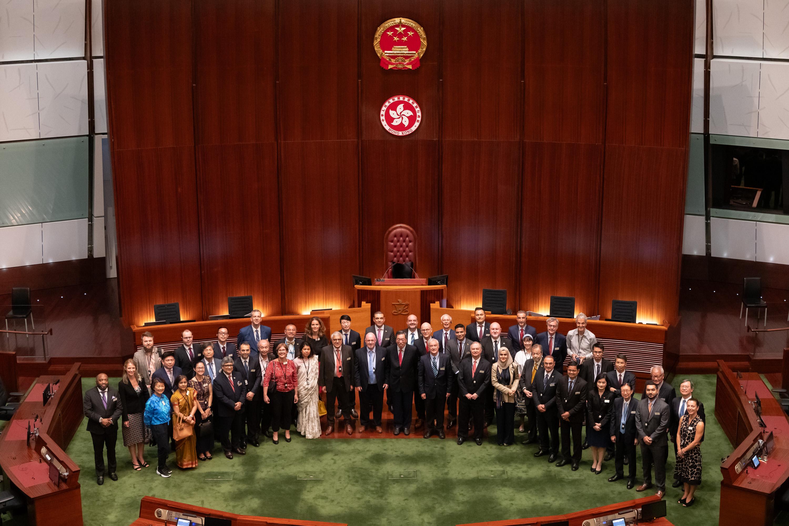 A cocktail reception between the Legislative Council (LegCo) Members and the Consuls-General (CGs) as well as Honorary Consuls (HCs) in Hong Kong was held today (July 11) in the LegCo Complex. The President of LegCo, Mr Andrew Leung (front row, centre), poses for a group photo with the CGs or their representatives as well as HCs in Hong Kong in the Chamber of the LegCo Complex.