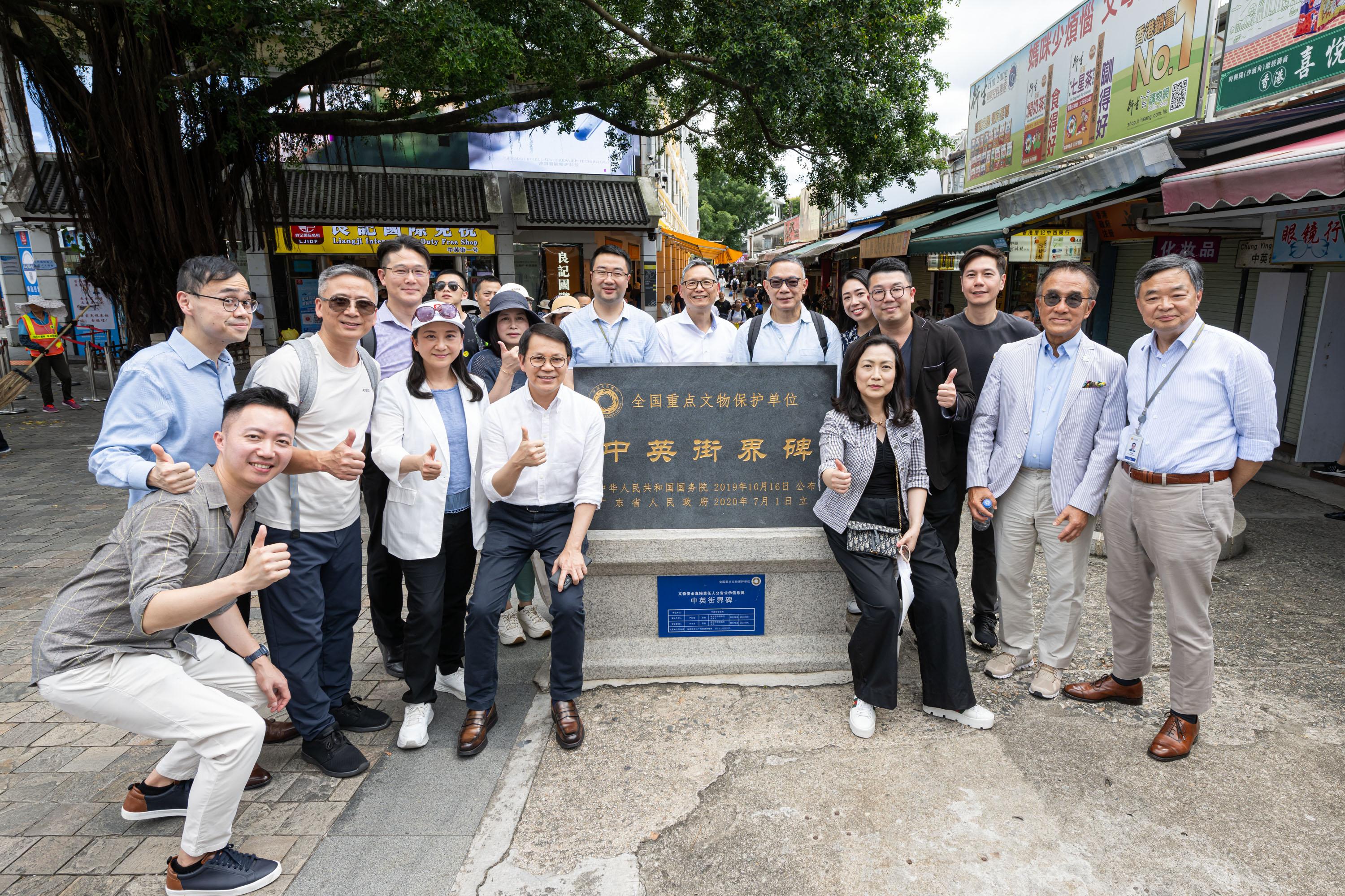 The Legislative Council (LegCo) Panel on Security visits Sha Tau Kok and Liantang/Heung Yuen Wai Boundary Control Point today (July 11). Photo shows LegCo Members and representatives of the Administration posing for a group photo at the Anglo-Chinese boundary stone in Chung Ying Street.
