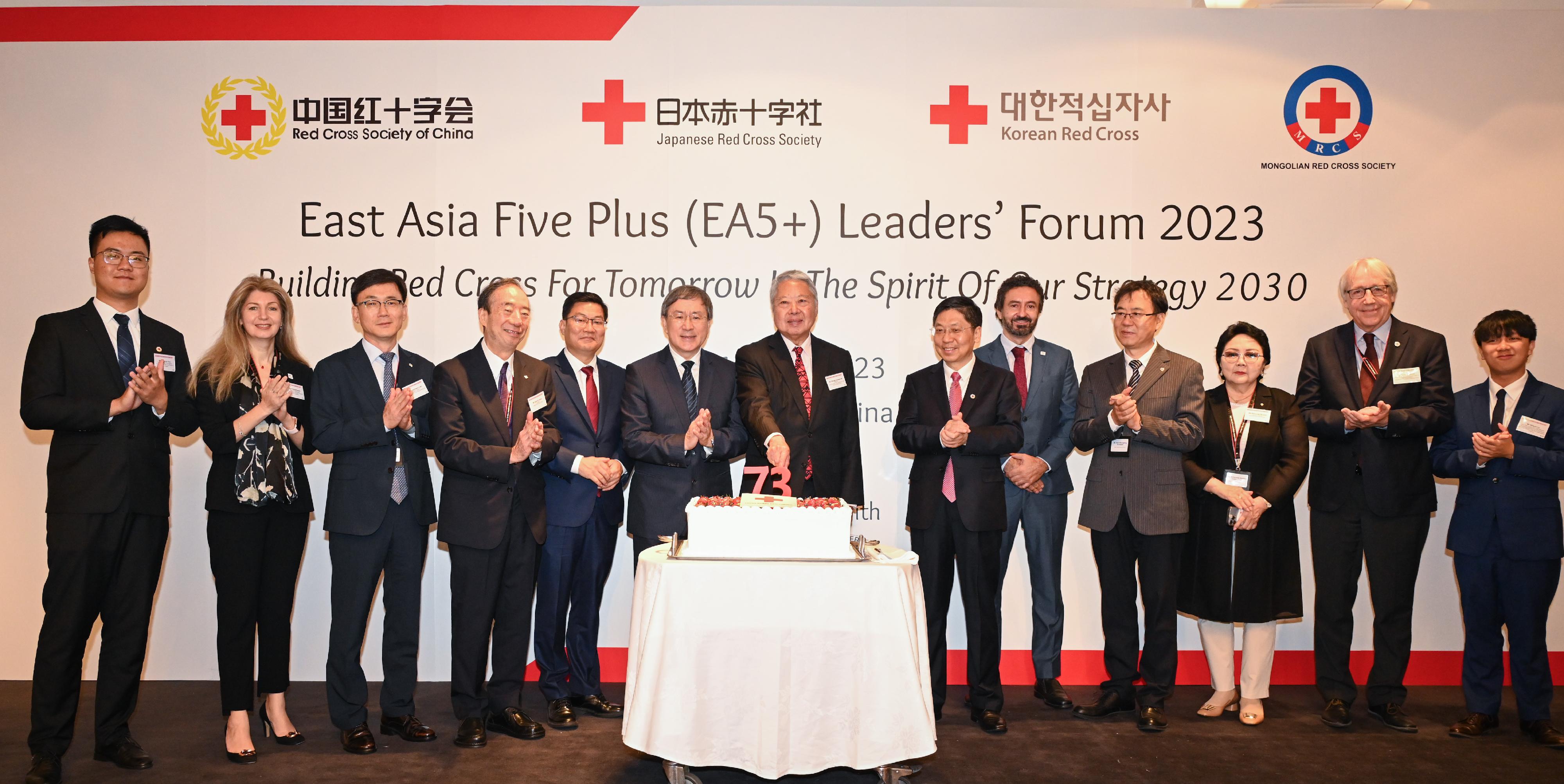 The Deputy Chief Secretary for Administration, Mr Cheuk Wing-hing (sixth left), joins the President of the Hong Kong Red Cross, Mr George Joseph Ho (centre), and guests in a cake cutting at the East Asia Five Plus (EA5+) Leaders' Forum 2023 Opening Ceremony and Hong Kong Red Cross 73rd Anniversary Celebration today (July 12). Also present are the Executive Vice President of the Red Cross Society of China, Mr Wang Ke (sixth right), and the Deputy Director-General of the Co-ordination Department of the Liaison Office of the Central People's Government in the Hong Kong Special Administrative Region, Mr Chen Zetao (fifth left).