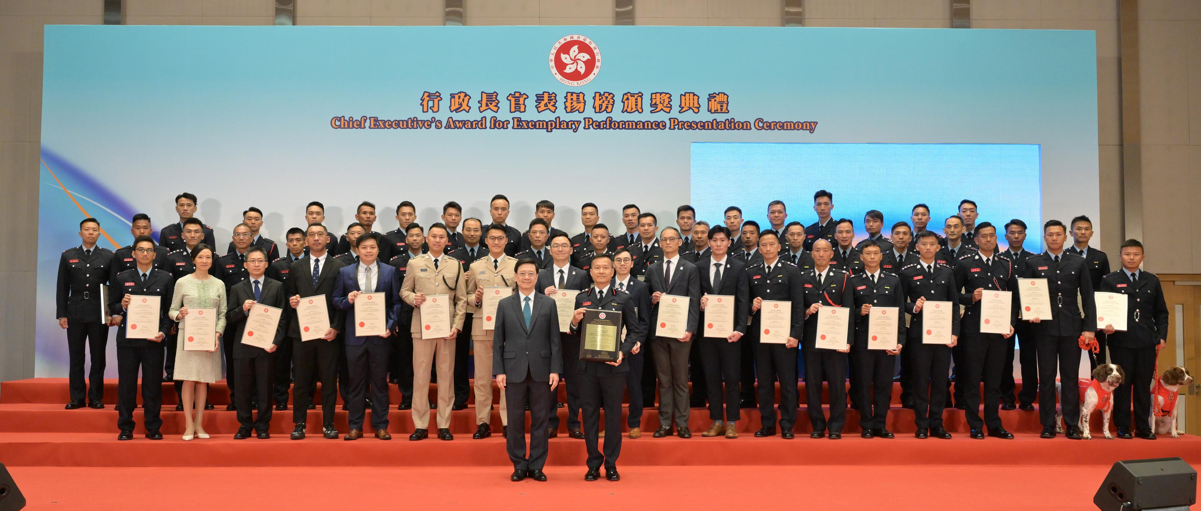 The Chief Executive, Mr John Lee, attended the Chief Executive's Award for Exemplary Performance Presentation Ceremony today (July 13). Photo shows Mr Lee (front row, left) with awarded members and rescue dogs of the Hong Kong Special Administrative Region search and rescue team deployed to quake-stricken areas of Türkiye in 2023 at the ceremony.