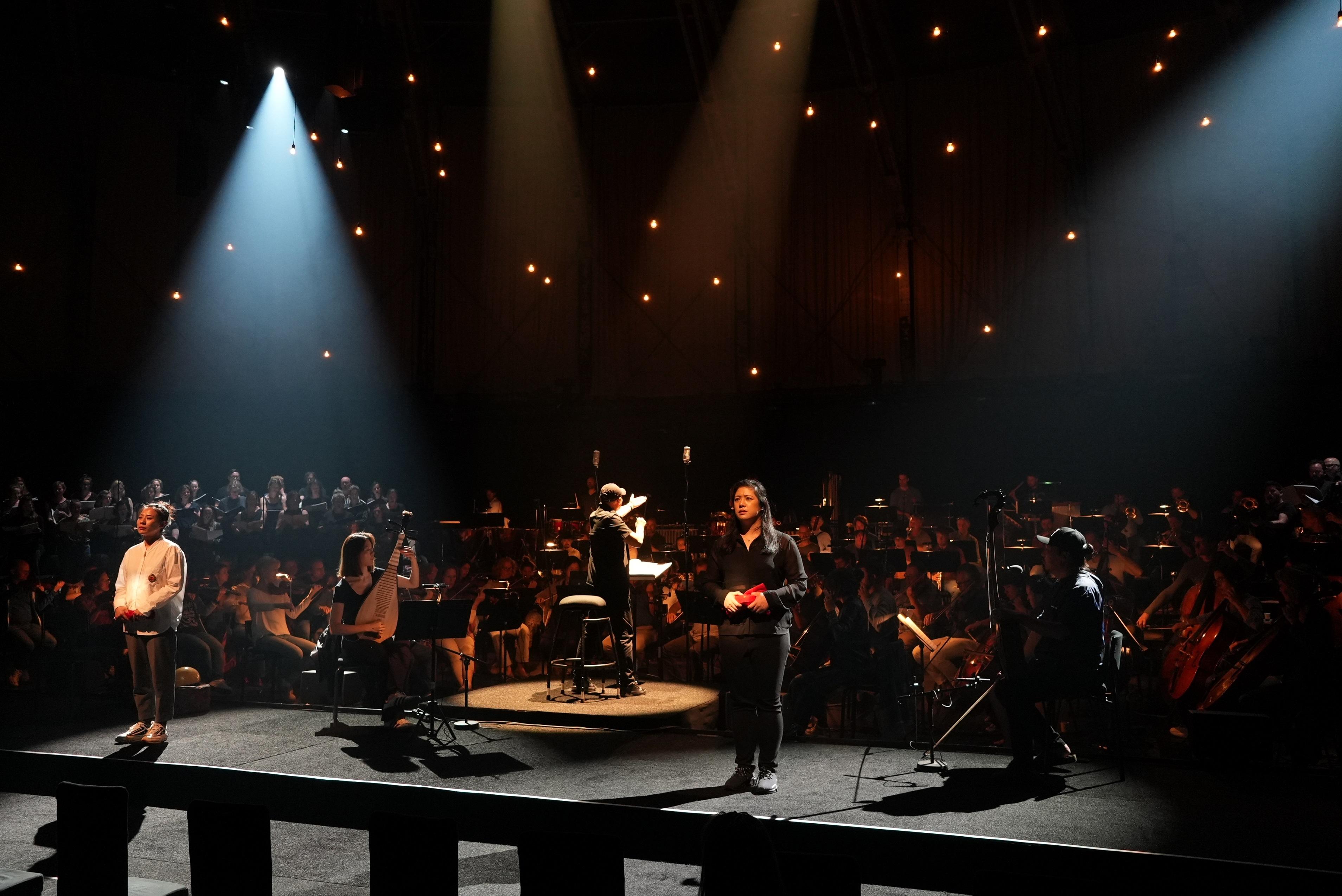 Hong Kong's Ambassador for Cultural Promotion Tan Dun invited Hong Kong young soprano Candice Chung to perform the world premiere of "Requiem for Nature" at the 76th edition of the Holland Festival. Photo shows Tan (centre) and Candice Chung (second right) rehearsing before the performance.