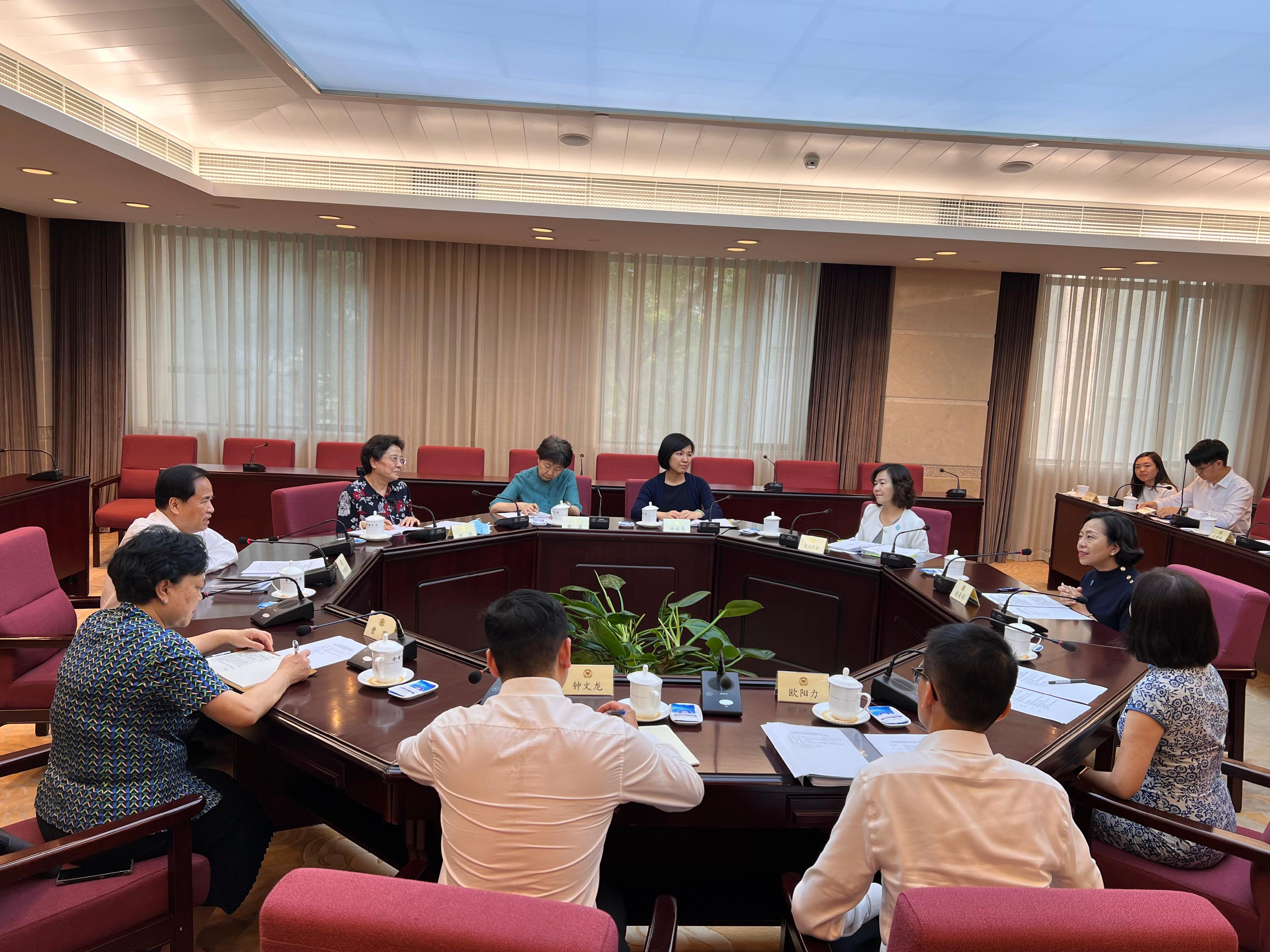 The Secretary for Home and Youth Affairs, Miss Alice Mak, continued her visit in Beijing today (July 18) and visited the Committee on Liaison with Hong Kong, Macao, Taiwan and Overseas Chinese of the National Committee of the Chinese People's Political Consultative Conference (CPPCC). Photo shows Miss Mak (first right) meeting with the Chairperson of the Committee on Liaison with Hong Kong, Macao, Taiwan and Overseas Chinese of the National Committee of the CPPCC, Mr Liu Cigui (first left), to exchange views on ways to promote Hong Kong young people to integrate into the overall development of the country.