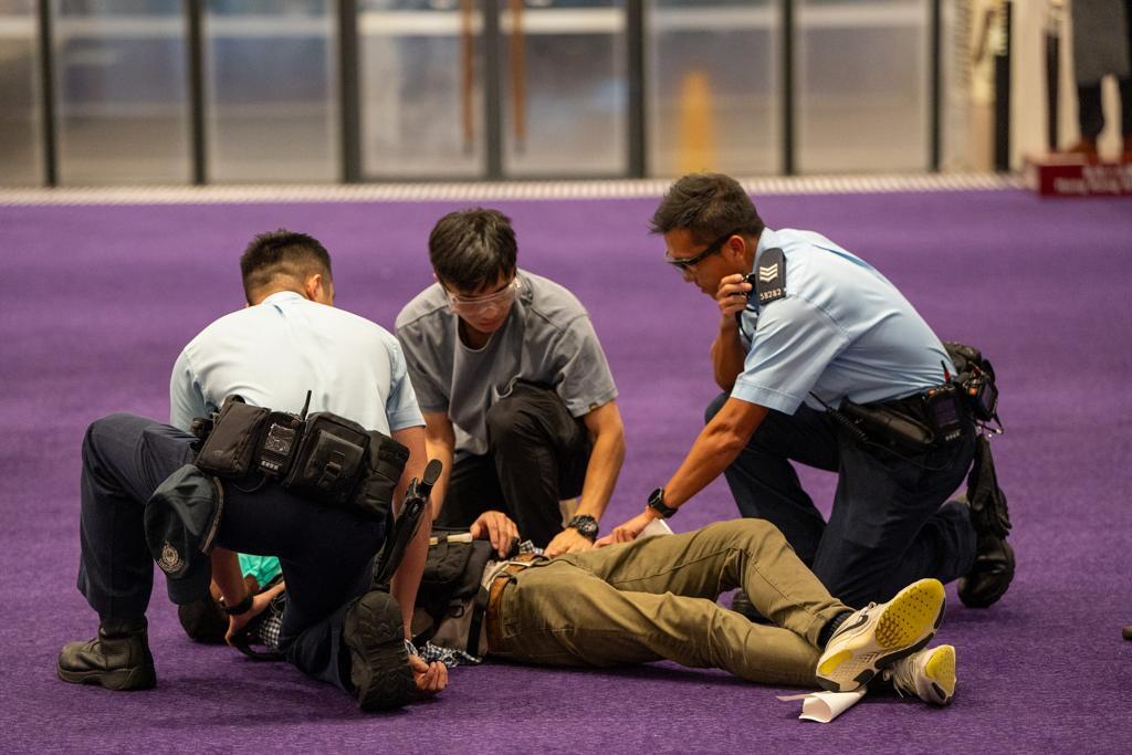 Police held a counter-terrorism exercise codenamed "PURPLEFLAME" at the Hong Kong City Hall in the early hours today (July 19). Picture shows the officers assisting an injured person. 