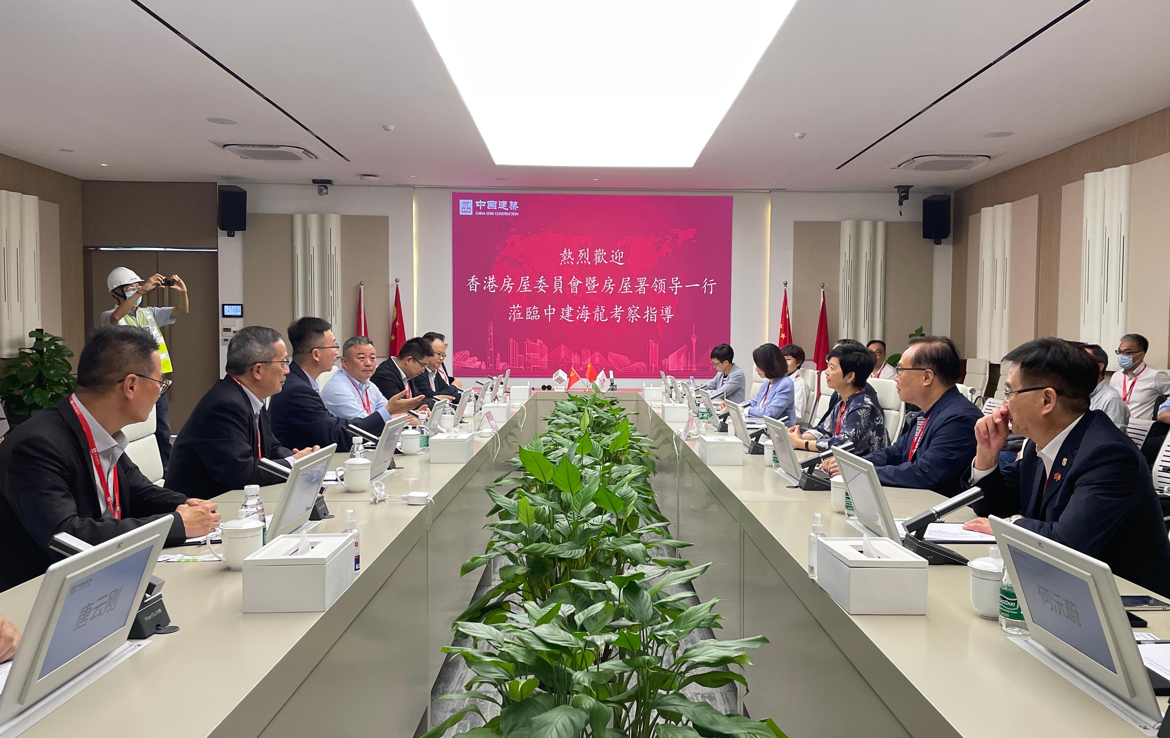 The Secretary for Housing and Chairman of the Hong Kong Housing Authority (HA), Ms Winnie Ho, and members of the HA Building Committee and Tender Committee, visited Foshan and Zhuhai today (July 19) to get an understanding of the latest situation regarding research and development and applications of innovative construction technologies in the Guangdong-Hong Kong-Macao Greater Bay Area cities. Photo shows Ms Ho (third right) and the Chairman of the Building Committee, Dr Johnnie Chan (second right), visiting the Guangdong Hailong Construction Technology Company Limited in Zhuhai.