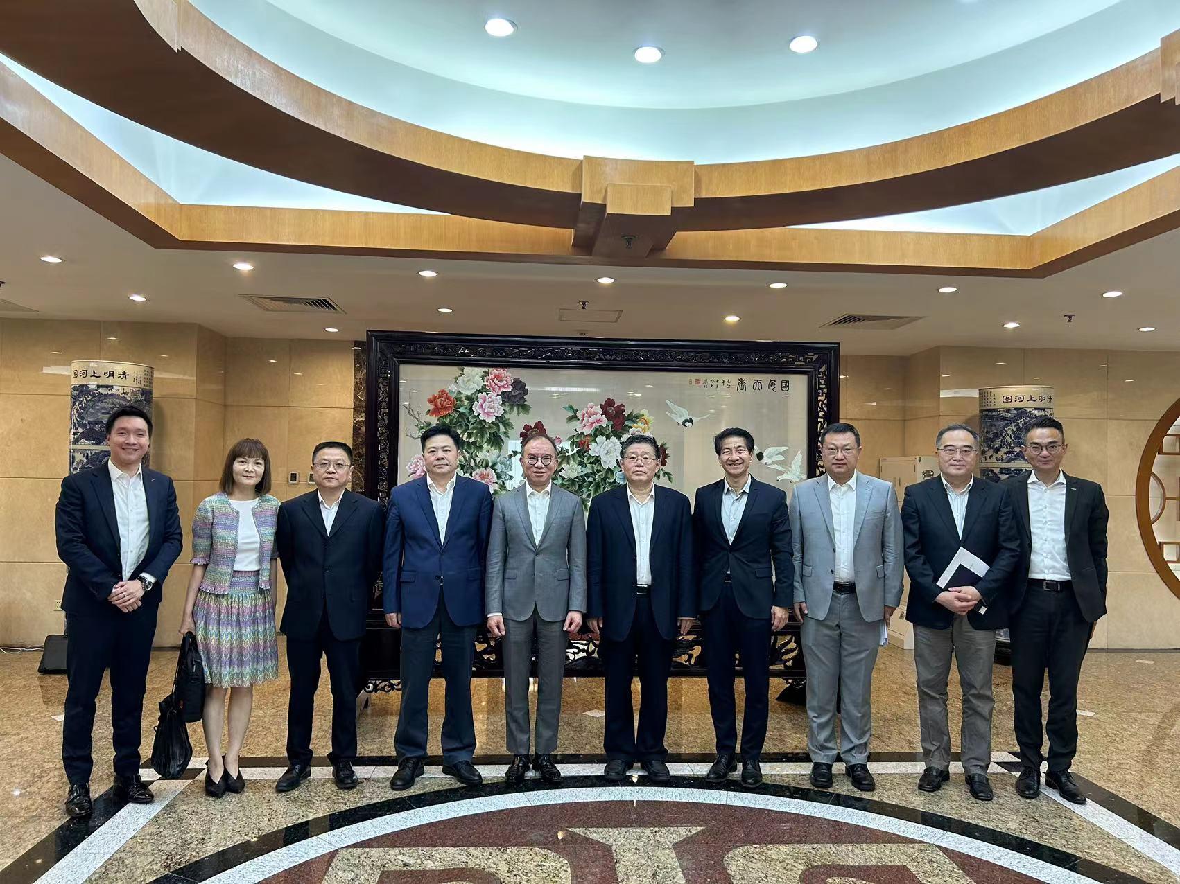 During his visit in Beijing, the Secretary for Constitutional and Mainland Affairs, Mr Erick Tsang Kwok-wai, meets with Deputy Director of the National Development and Reform Commission Mr Guo Lanfeng. Photo shows Mr Tsang (fifth left), Mr Guo (fifth right), the Commissioner for the Development of the Guangdong-Hong Kong-Macao Greater Bay Area, Ms Maisie Chan (second left), and the Director of the Office of the Government of the Hong Kong Special Administrative Region in Beijing, Mr Rex Chang (fourth right) taking a group photo.