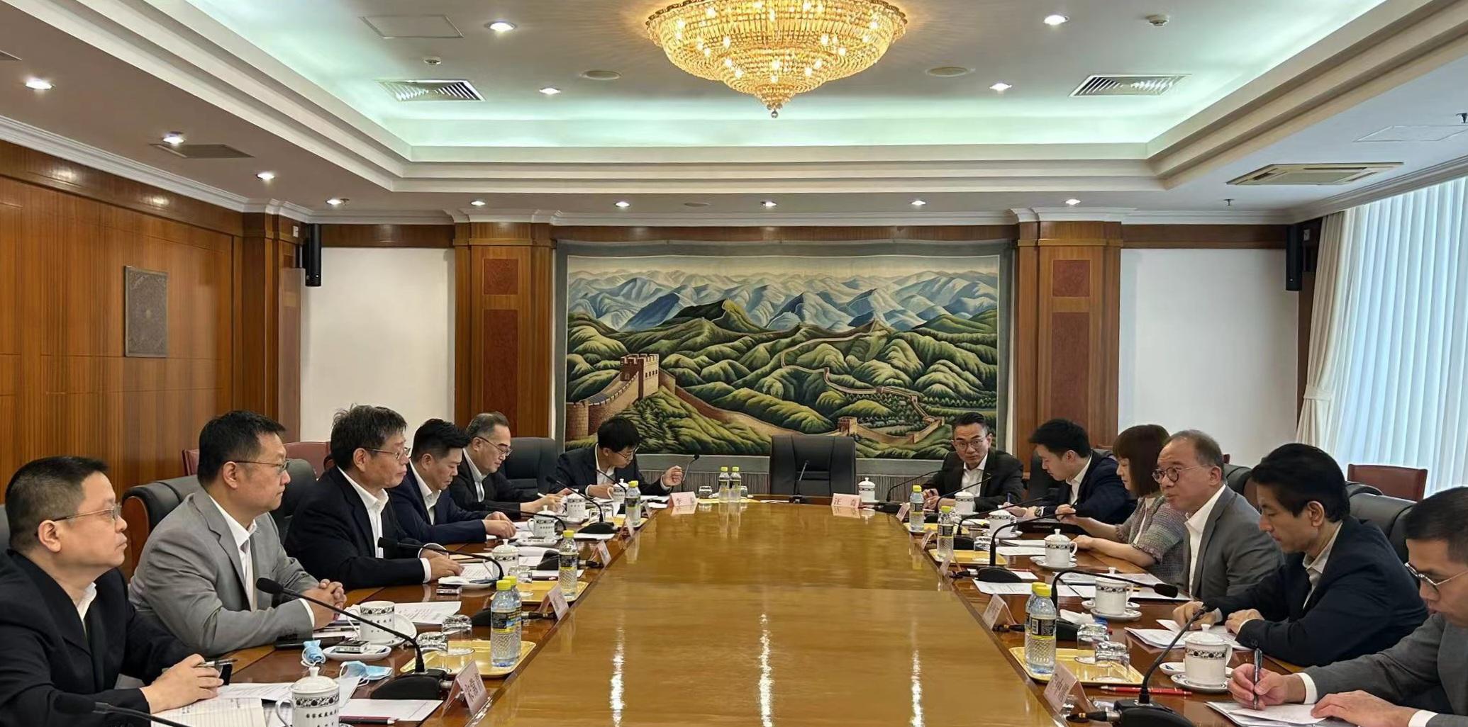 During his visit in Beijing, the Secretary for Constitutional and Mainland Affairs, Mr Erick Tsang Kwok-wai (third right), meets with Deputy Director of the National Development and Reform Commission Mr Guo Lanfeng (third left). Also attending the meeting are the Commissioner for the Development of the Guangdong-Hong Kong-Macao Greater Bay Area, Ms Maisie Chan (fourth right), and the Director of the Office of the Government of the Hong Kong Special Administrative Region in Beijing, Mr Rex Chang (second right).