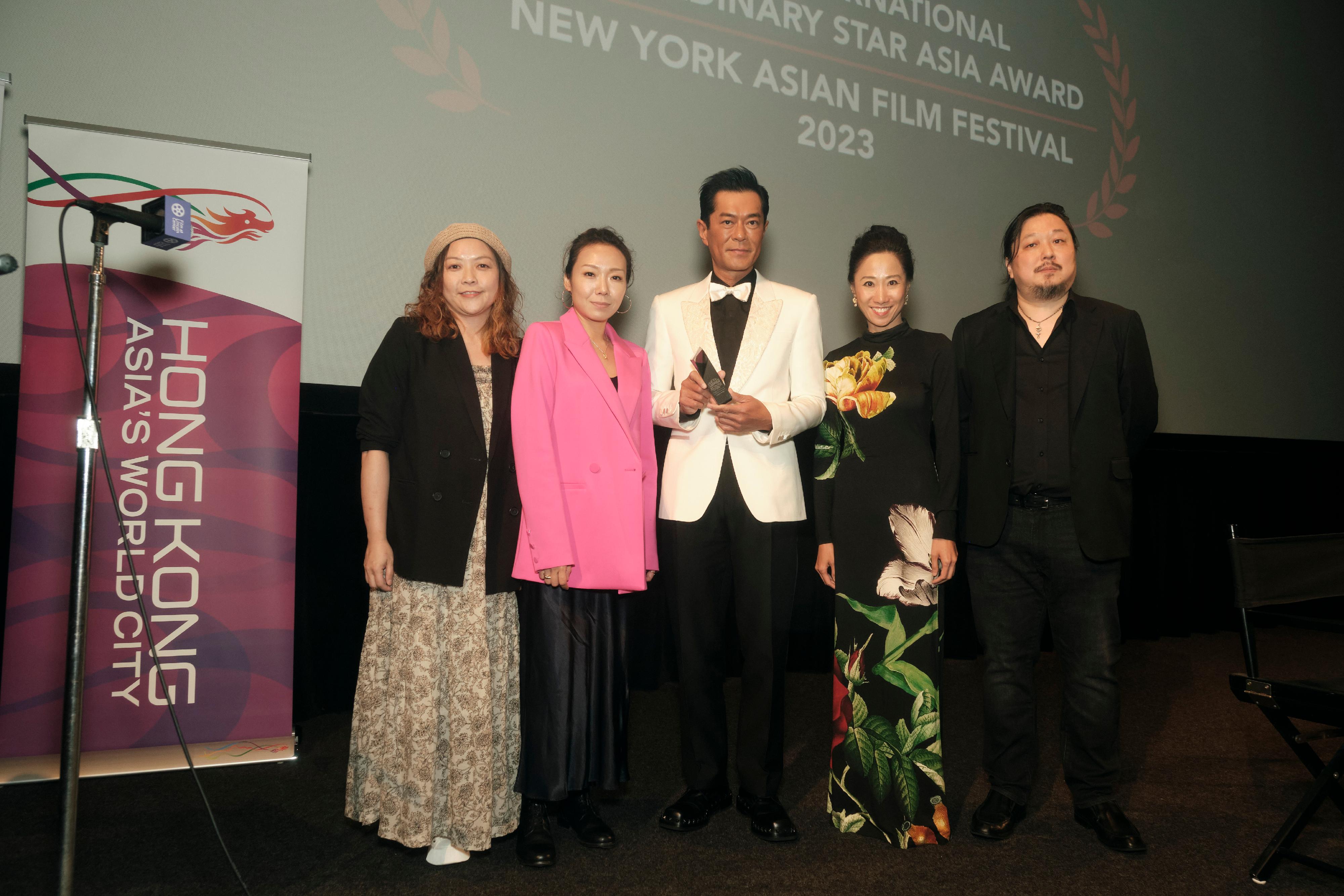 Hong Kong megastar Louis Koo was presented with the Extraordinary Star Asia Award for Exceptional Contribution to Asian Cinema presented by the New York Asian Film Festival (NYAFF) on July 19 (New York time) in recognition of his remarkable achievements in the creative industry in Hong Kong and Asia. Pictured at the award presentation ceremony are the Director of the Hong Kong Economic and Trade Office in New York, Ms Candy Nip (second right); Koo (centre); the Executive Director of the NYAFF, Mr Samuel Jamier (first right); Director of the film "Vital Signs" Cheuk Wan-chi (second left); and producer of "Vital Signs" Jacqueline Liu (first left).