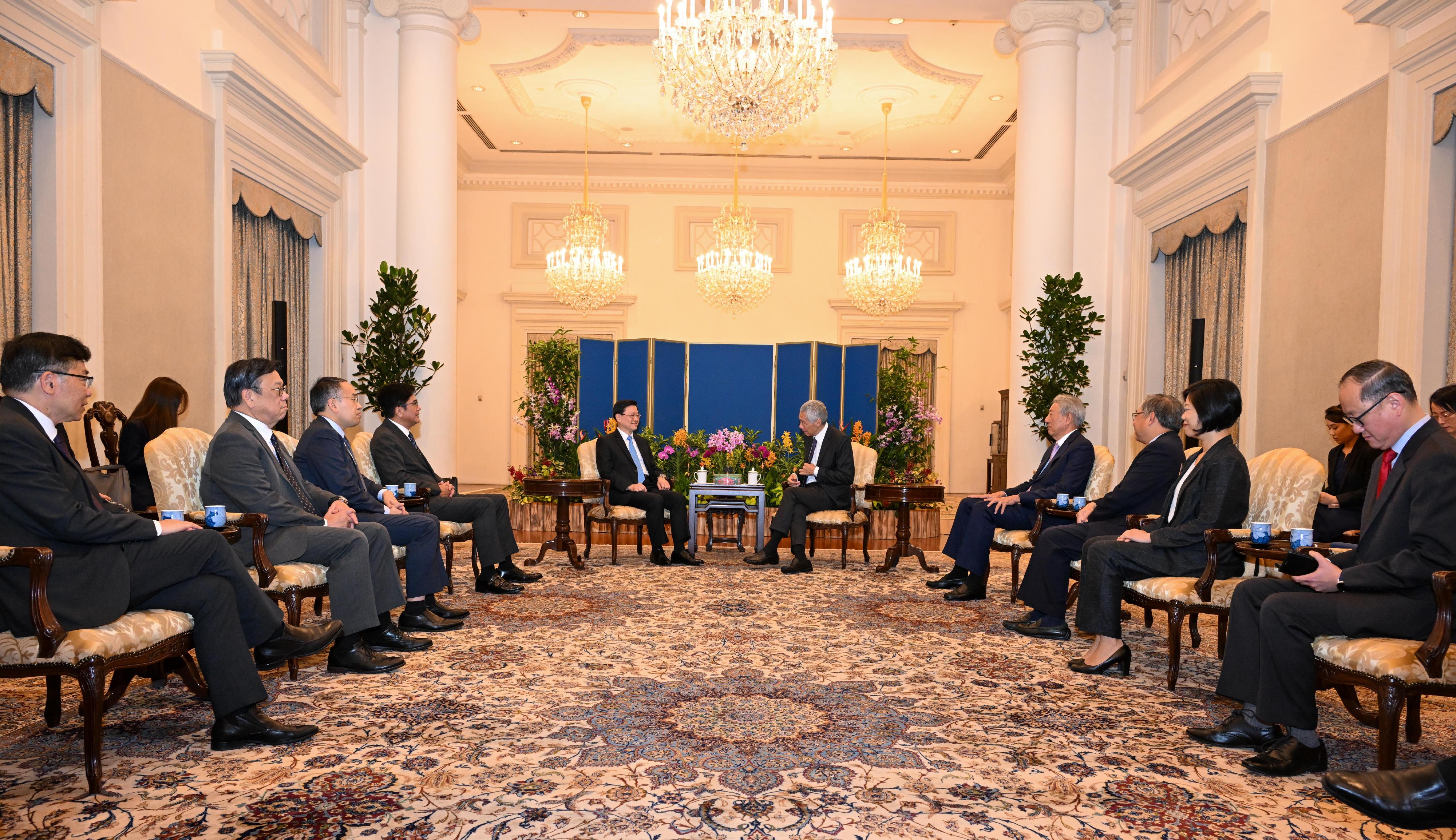 The Chief Executive, Mr John Lee, meets with the Prime Minister of Singapore, Mr Lee Hsien Loong, in Singapore today (July 24).