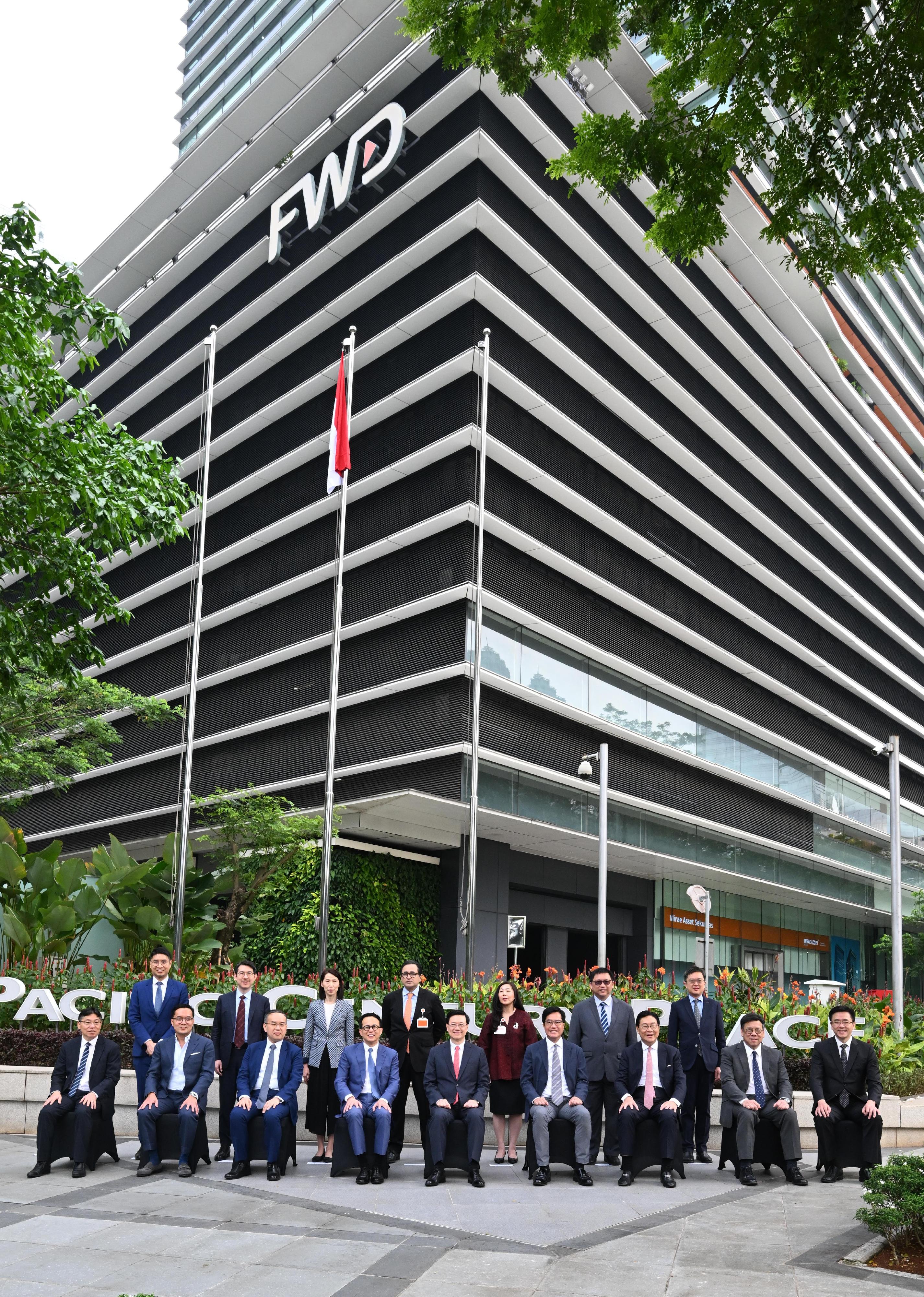 The Chief Executive, Mr John Lee, and a Hong Kong Special Administrative Region delegation visited the local office of a Hong Kong insurance company, FWD Group, in Jakarta, Indonesia today (July 26). Photo shows Mr Lee (front row, centre); the Deputy Financial Secretary, Mr Michael Wong (front row, fourth right); the Secretary for Financial Services and the Treasury, Mr Christopher Hui (front row, third left); the Secretary for Commerce and Economic Development, Mr Algernon Yau (front row, second right); the Secretary for Transport and Logistics, Mr Lam Sai-hung (front row, first left), with the Chairman of Pacific Century Group, Mr Richard Li (front row, fourth left), and representatives of the company.