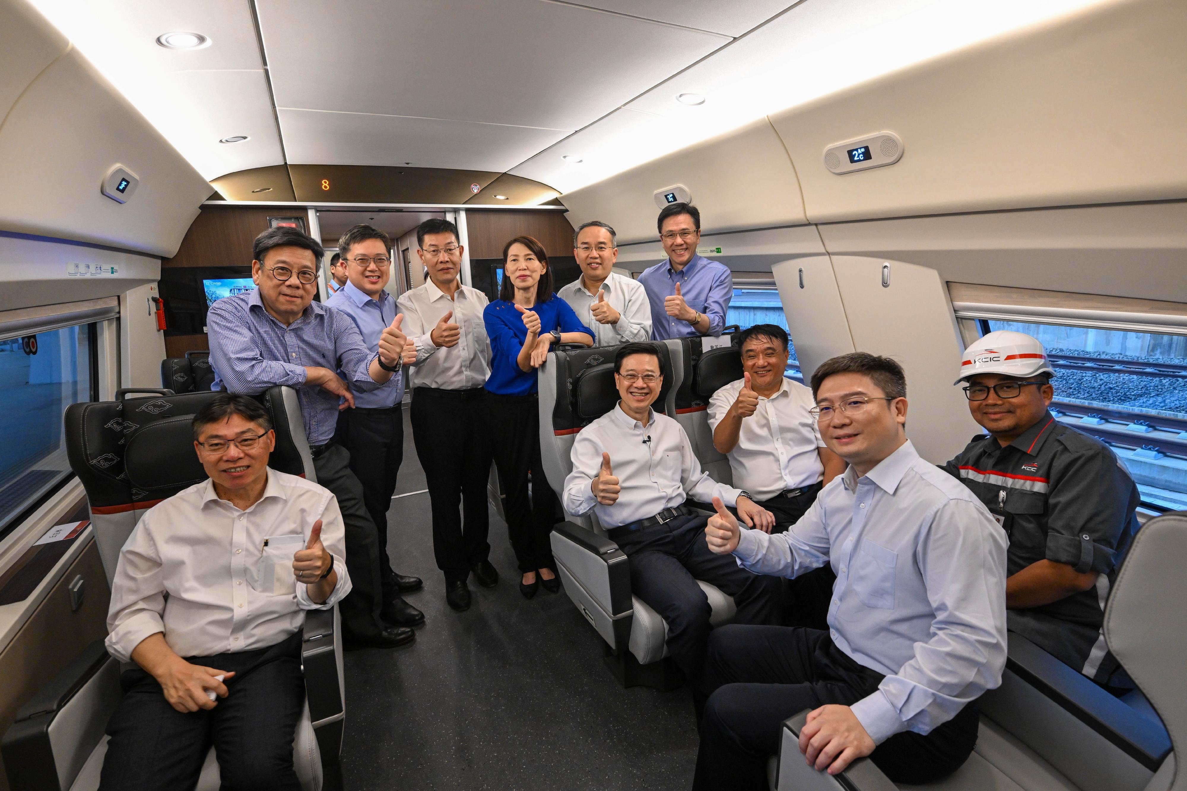 The Chief Executive, Mr John Lee, and the Hong Kong Special Administrative Region delegation visited the Jakarta-Bandung High Speed Railway in Jakarta, Indonesia today (July 26). Photo shows Mr Lee (front row, fourth right); the Secretary for Financial Services and the Treasury, Mr Christopher Hui (back row, second right); the Secretary for Commerce and Economic Development, Mr Algernon Yau (back row, first left); the Secretary for Transport and Logistics, Mr Lam Sai-hung (front row, first left); the Secretary for Innovation, Technology and Industry, Professor Sun Dong (back row, first right); the Director of the Chief Executive's Office, Ms Carol Yip (back row, third right); the Chairman of the Chinese Railway International Group, Mr Ju Guojiang (front row, third right); and other representatives of the railway company.