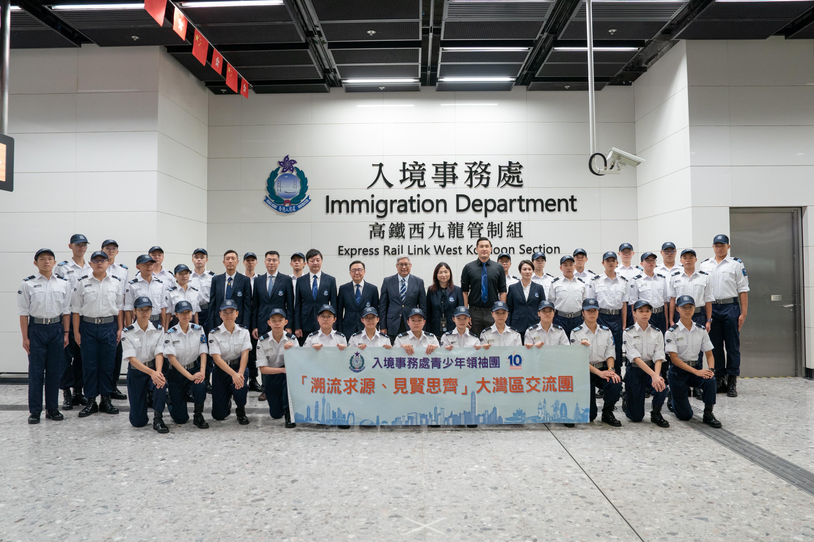The Immigration Department Youth Leaders Corps (IDYL) organised a summer exchange tour to the Greater Bay Area from July 24 to 26, 2023.  Photo shows 34 members of the IDYL, led by the Director of Immigration, Mr Au Ka-wang, (second row, eighth right), the Commissioner of the IDYL, Dr Cheng Kam-chung, (second row, eighth left), and three Deputy Commissioners of the IDYL, setting off the tour at the Express Rail Link West Kowloon station.