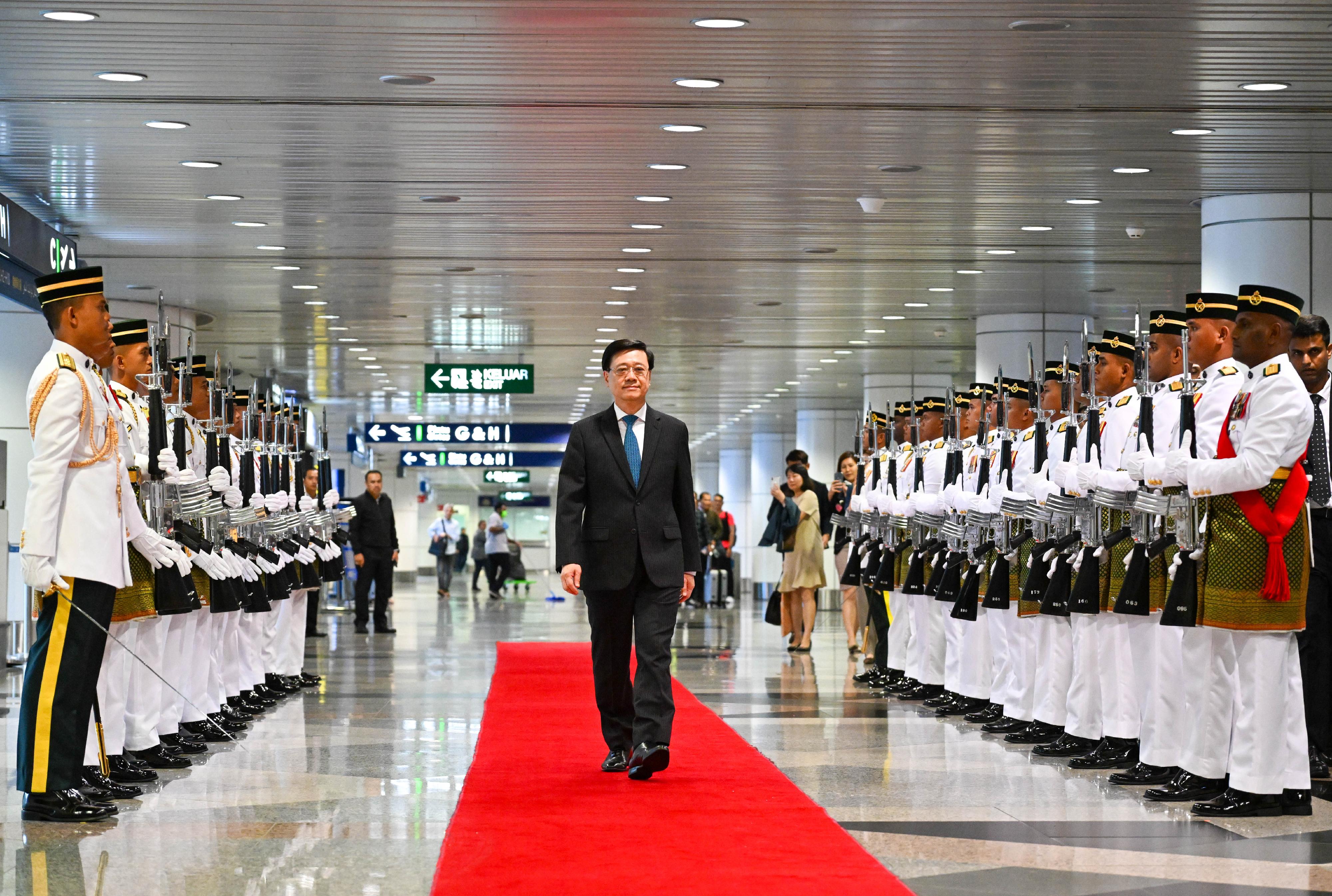 The Chief Executive, Mr John Lee, arrives in Kuala Lumpur, Malaysia, this morning (July 27).