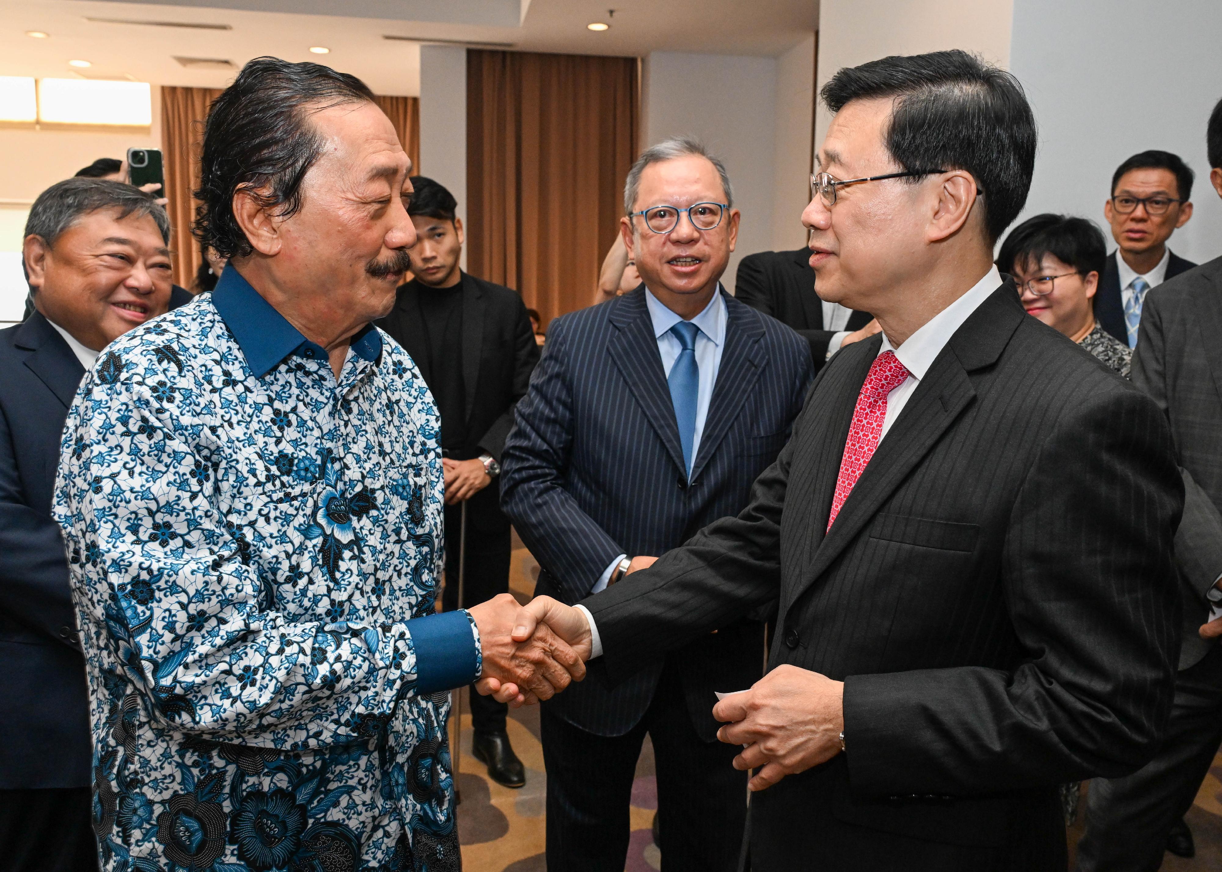 The Chief Executive, Mr John Lee, and a Hong Kong Special Administrative Region delegation visited Berjaya Corporation Berhad in Kuala Lumpur, Malaysia today (July 28). Photo shows Mr Lee (right) being greeted by the Founder of Berjaya Corporation Berhad, Mr Vincent Tan (left).