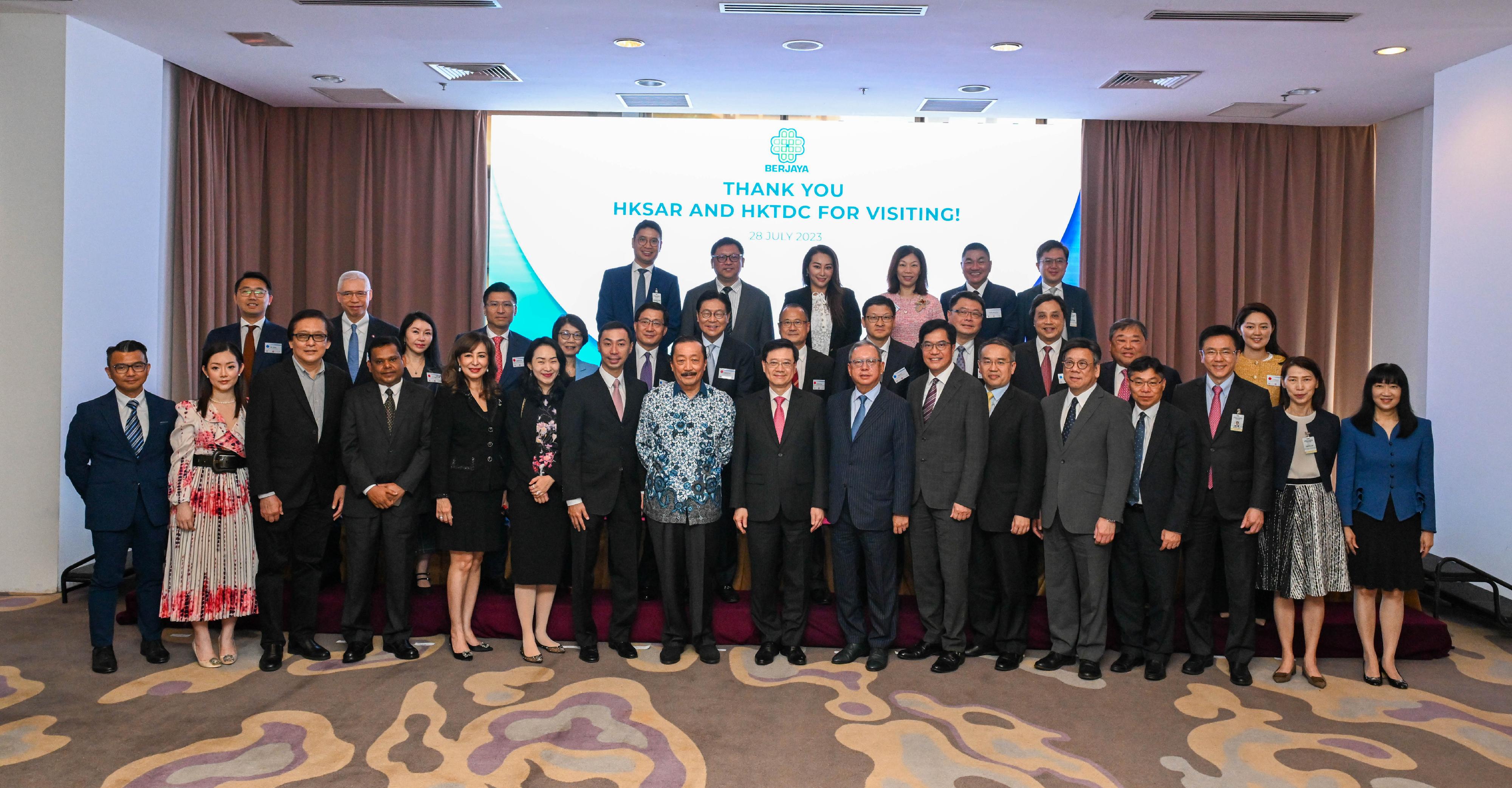 The Chief Executive, Mr John Lee, and a Hong Kong Special Administrative Region delegation visited Berjaya Corporation Berhad in Kuala Lumpur, Malaysia today (July 28). Photo shows (front row, from third right) the Secretary for Innovation, Technology and Industry, Professor Sun Dong; the Secretary for Transport and Logistics, Mr Lam Sai-hung; the Secretary for Commerce and Economic Development, Mr Algernon Yau; the Secretary for Financial Services and the Treasury, Mr Christopher Hui; the Deputy Financial Secretary, Mr Michael Wong; the Chairman of the Hong Kong Trade Development Council, Dr Peter Lam; Mr Lee; the Founder of Berjaya Corporation Berhad, Mr Vincent Tan, and other members of the delegation and representatives of the company.